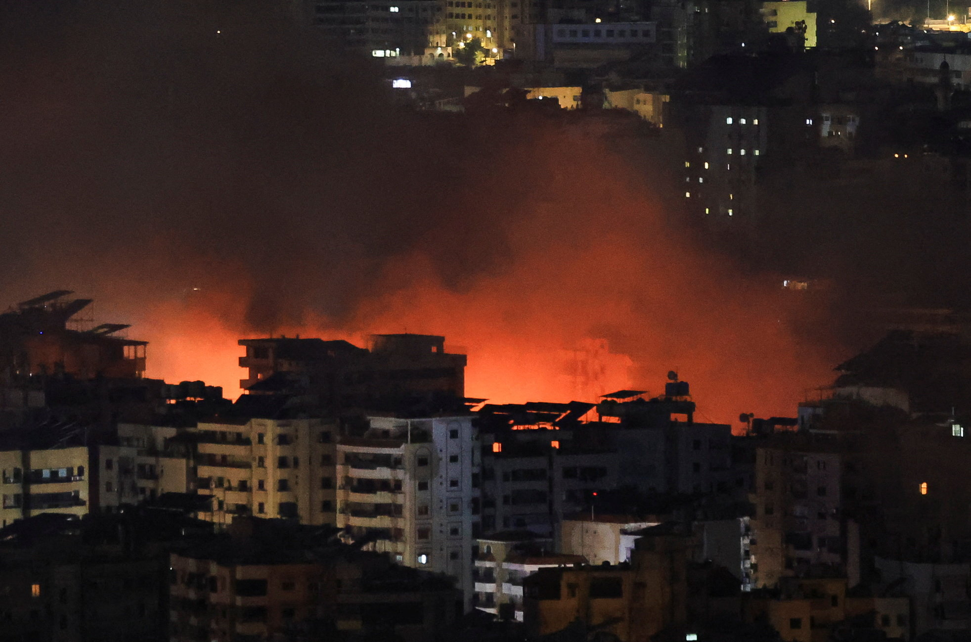 Smoke billows after reported strikes on Beirut's southern suburbs.