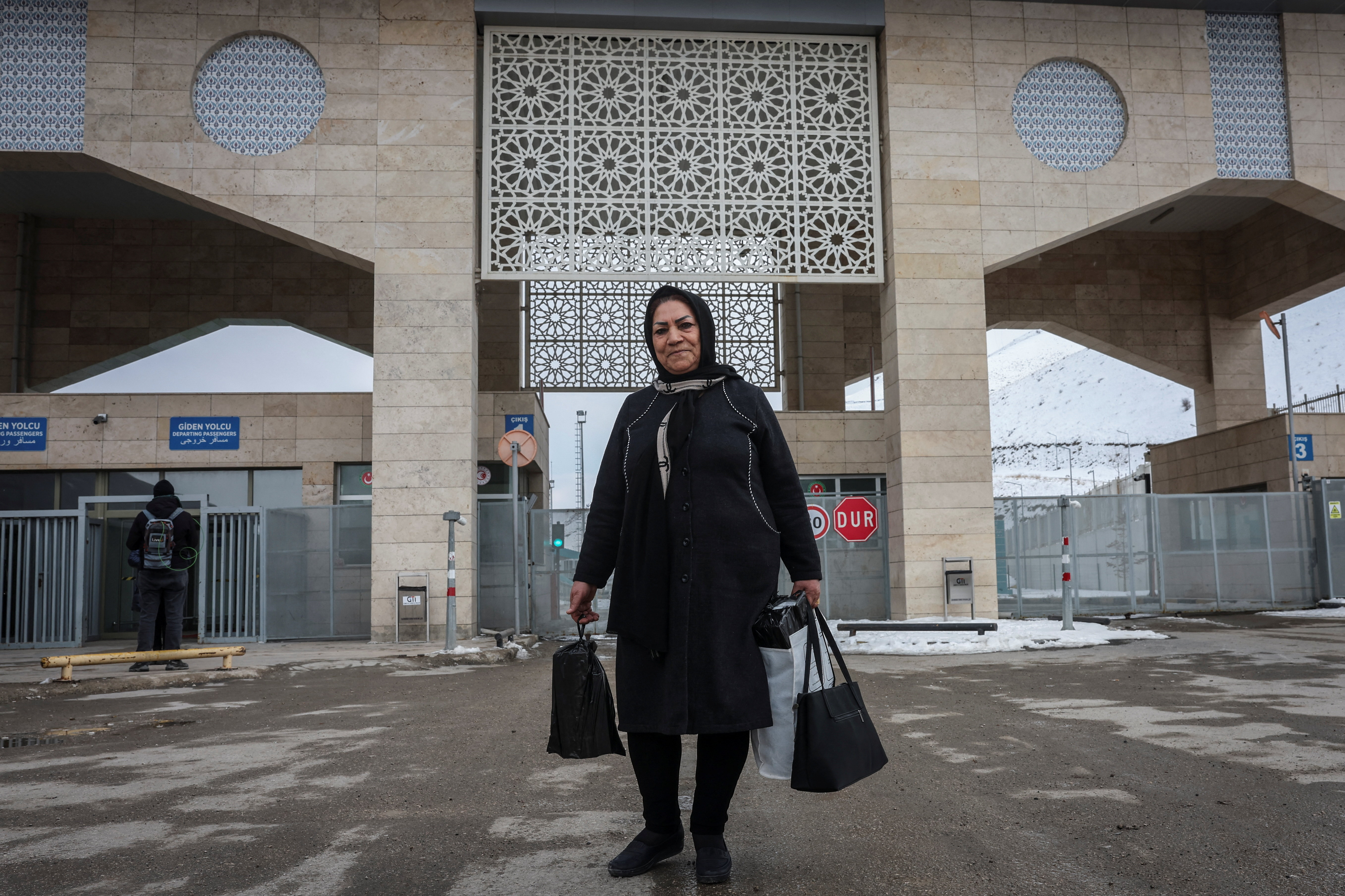 Iranians make their way after crossing into Turkey at the Kapikoy Border Gate in the eastern Van province