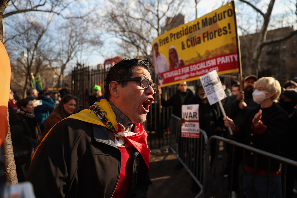 Demonstrators in front of a courthouse for the trial of Nicolas Maduro
