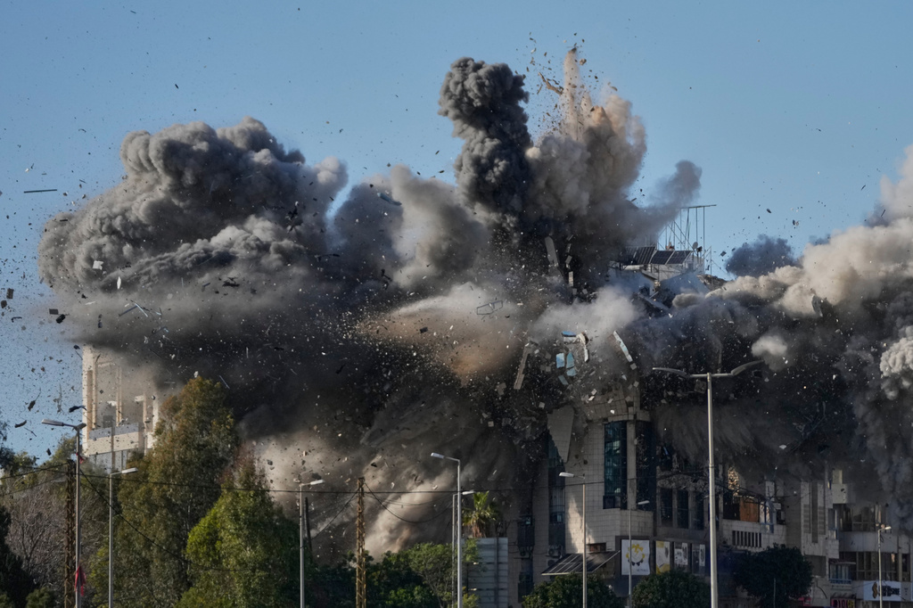 Smoke rises after an Israeli airstrike hits a building near the airport road in Beirut, Lebanon