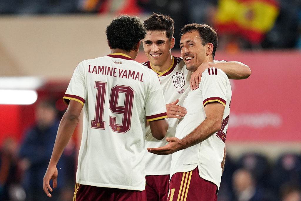 Mikel Oyarzabal of Spain celebrates scoring his team's second goal with teammates Pau Cubarsi and Lamine Yamal of Spain