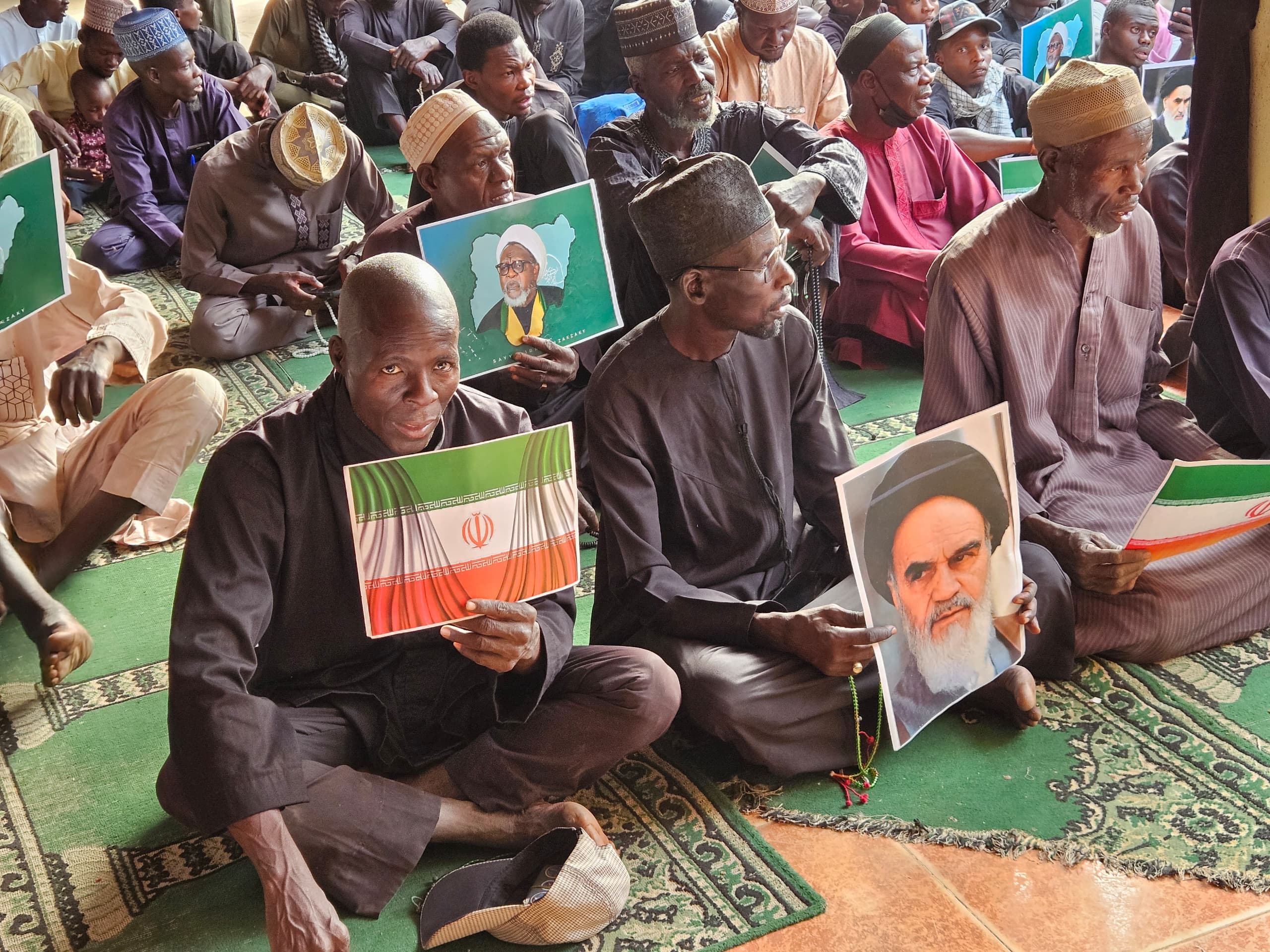 After the killing of Khamenei, followers of the Islamic Movement Nigeria gather in a mosque in Kano, some holding photos of their leader, Ibrahim el-Zakzaky, and former Iranian Supreme Leaders Ali Khamenei and Ruhollah Khomeini