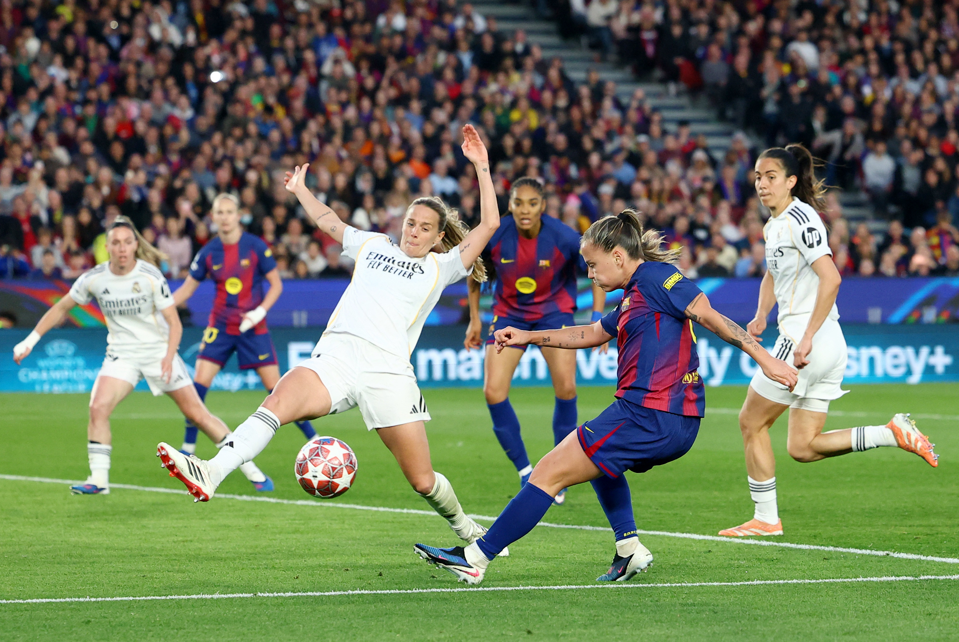 Barcelona's Claudia Pina shoots at Real Madrid's goal