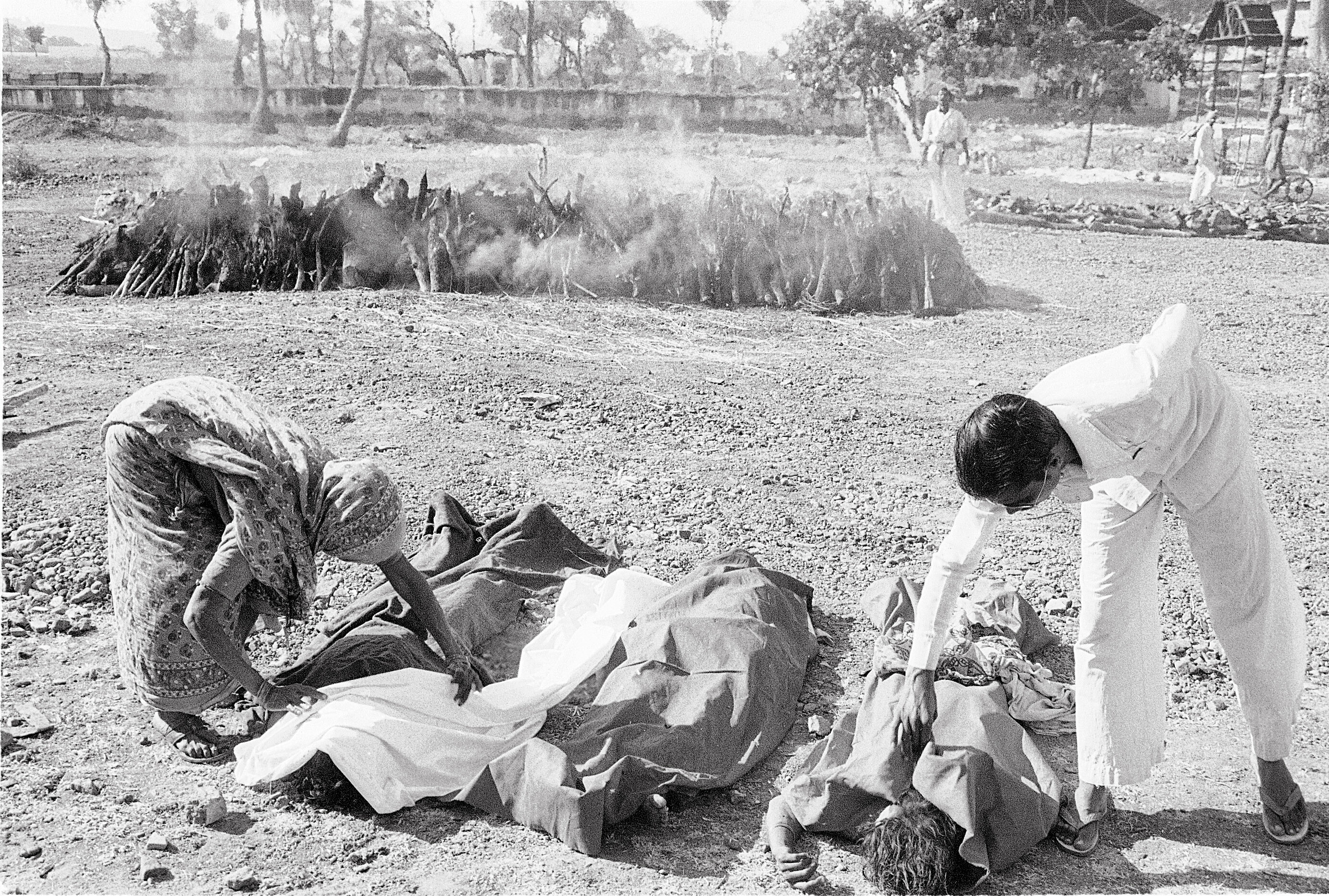 Bodies next to a funeral pyre in the aftermath of the 1984 Bhopal gas tragedy