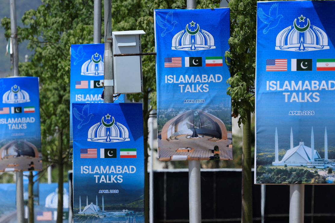 Hoardings are mounted on lamp posts, as Pakistan prepares to host the United States and Iran for a possible second phase of peace talks in Islamabad [Akhtar Soomro/Reuters]