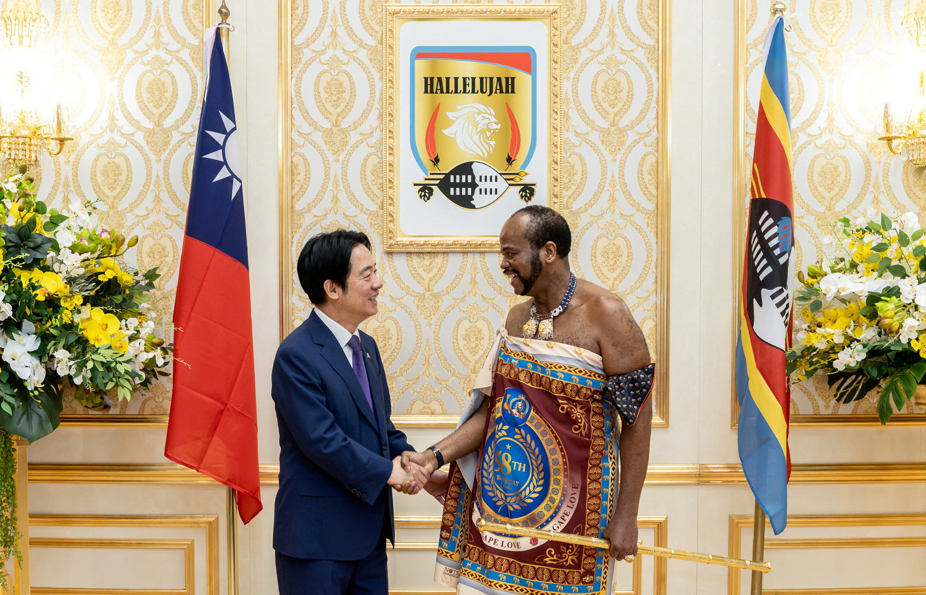 Taiwanese President Lai Ching-te shakes hands with King Mswati III, the King of Eswatini,
