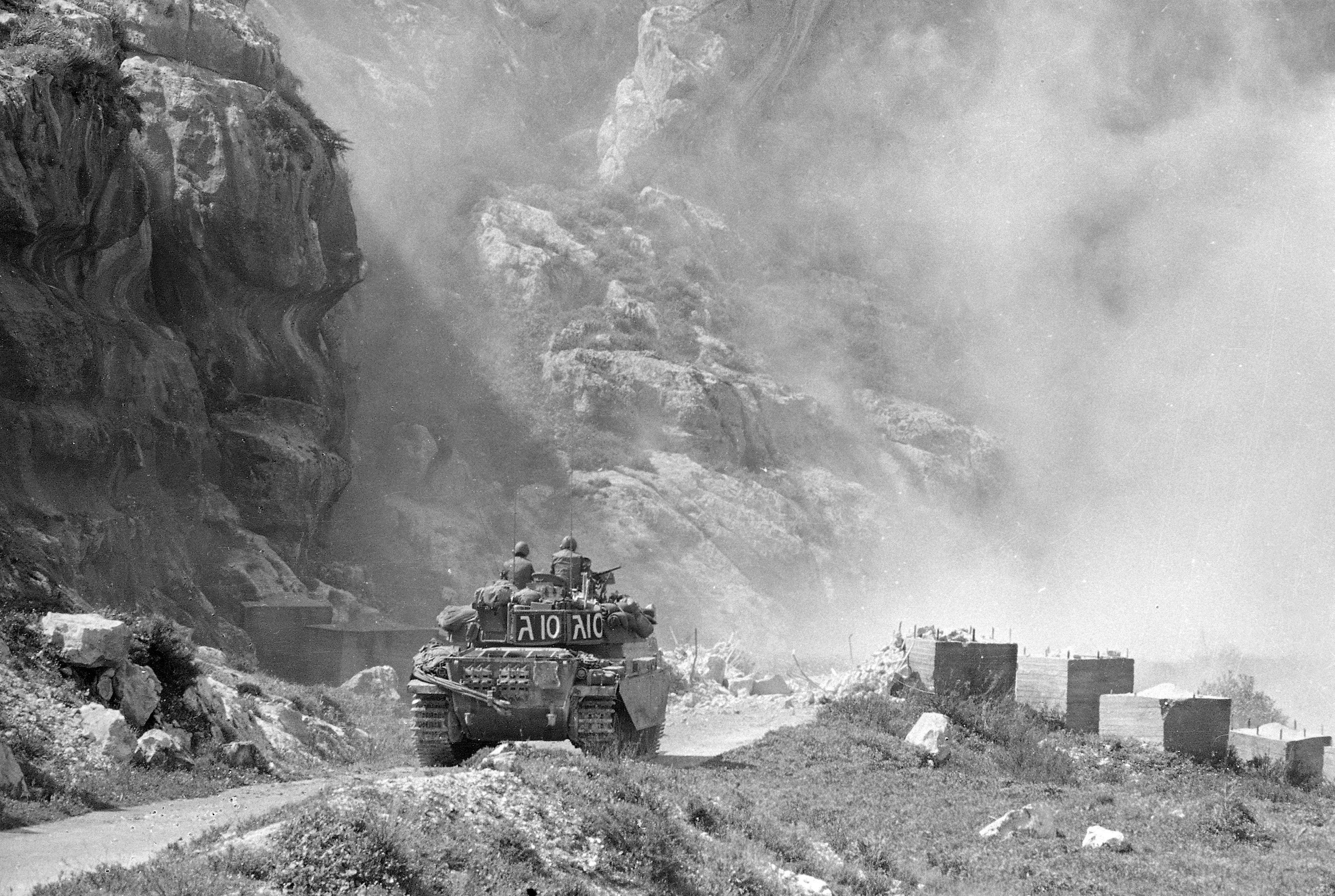 Smoke rises from shells fired by British made Centurion tank moving on road near Bazariya a town on hillside overlooking Lebanon's port city of Tyre March 20, 1978 (AP Photo/Saris)