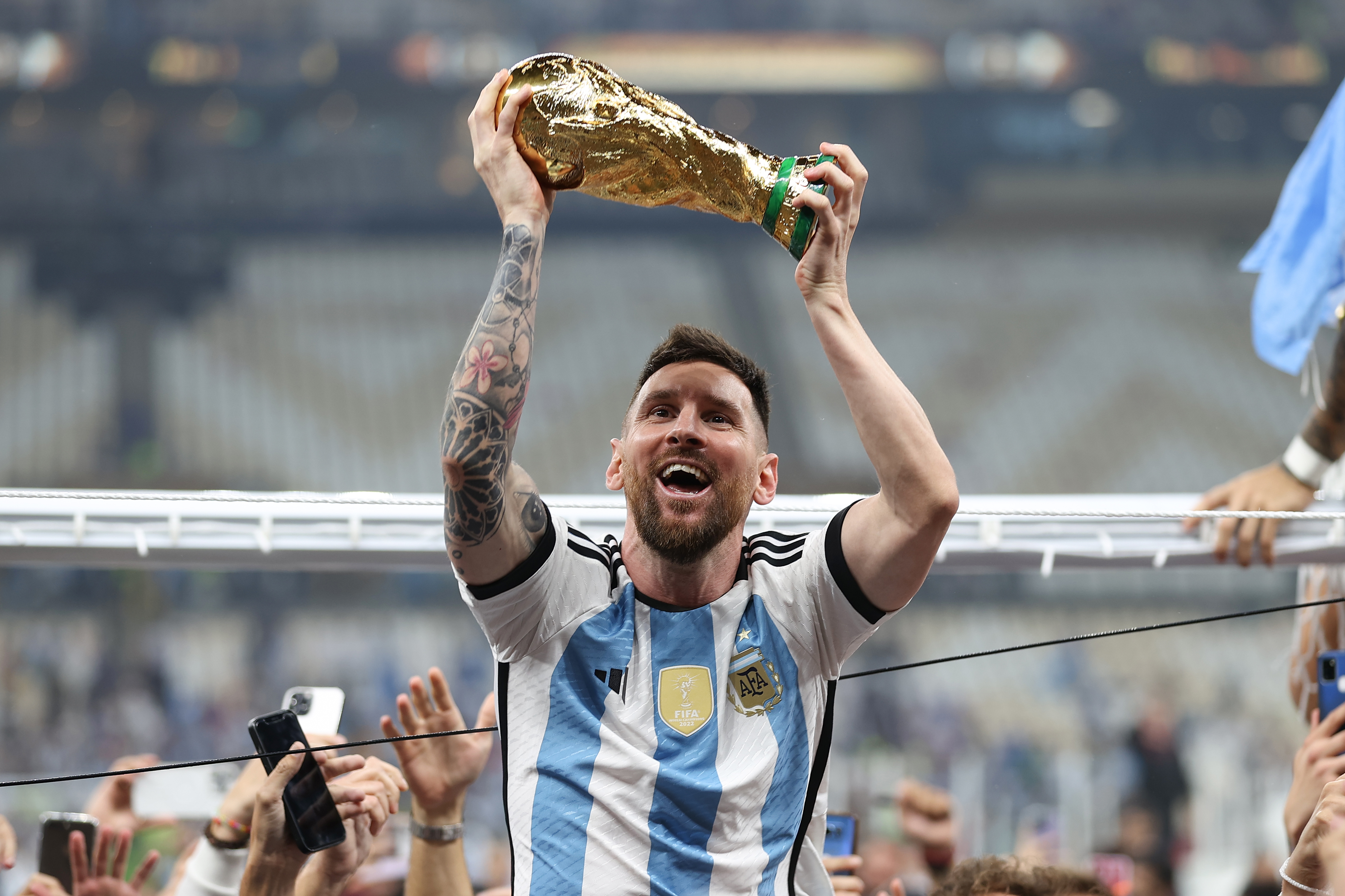 Lionel Messi holds the World Cup aloft after his side's victory over France | Argentina v France, FIFA World Cup 2022 Final, December 18, Lusail Stadium