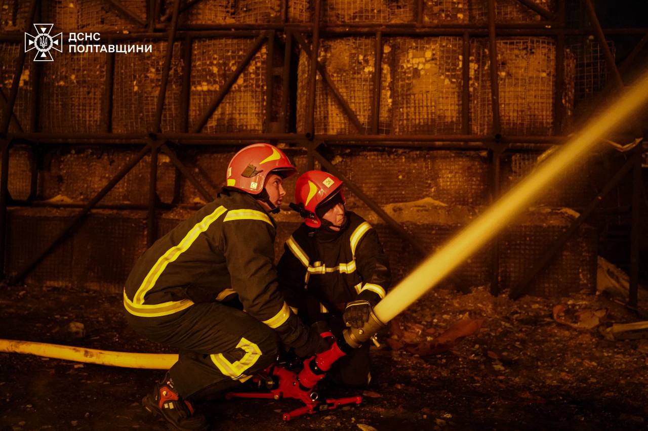 Ukrainian fire fighters extinguish a fire