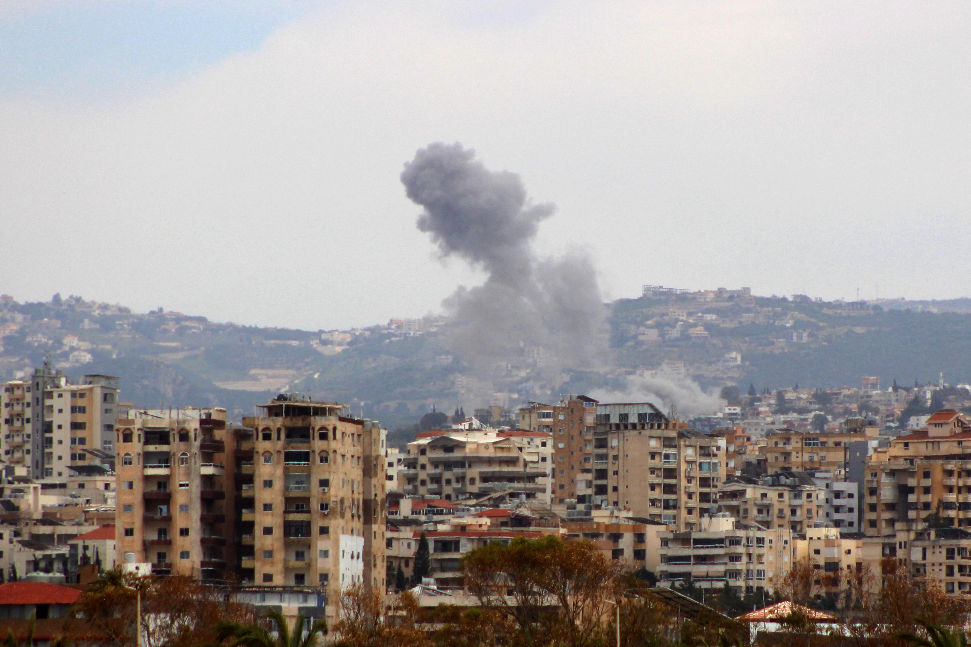 Smoke rises from the site of an Israeli airstrike that targeted the village of Hanaouay, as seen from nearby Tyre, in southern Lebanon on May 19, 2026.