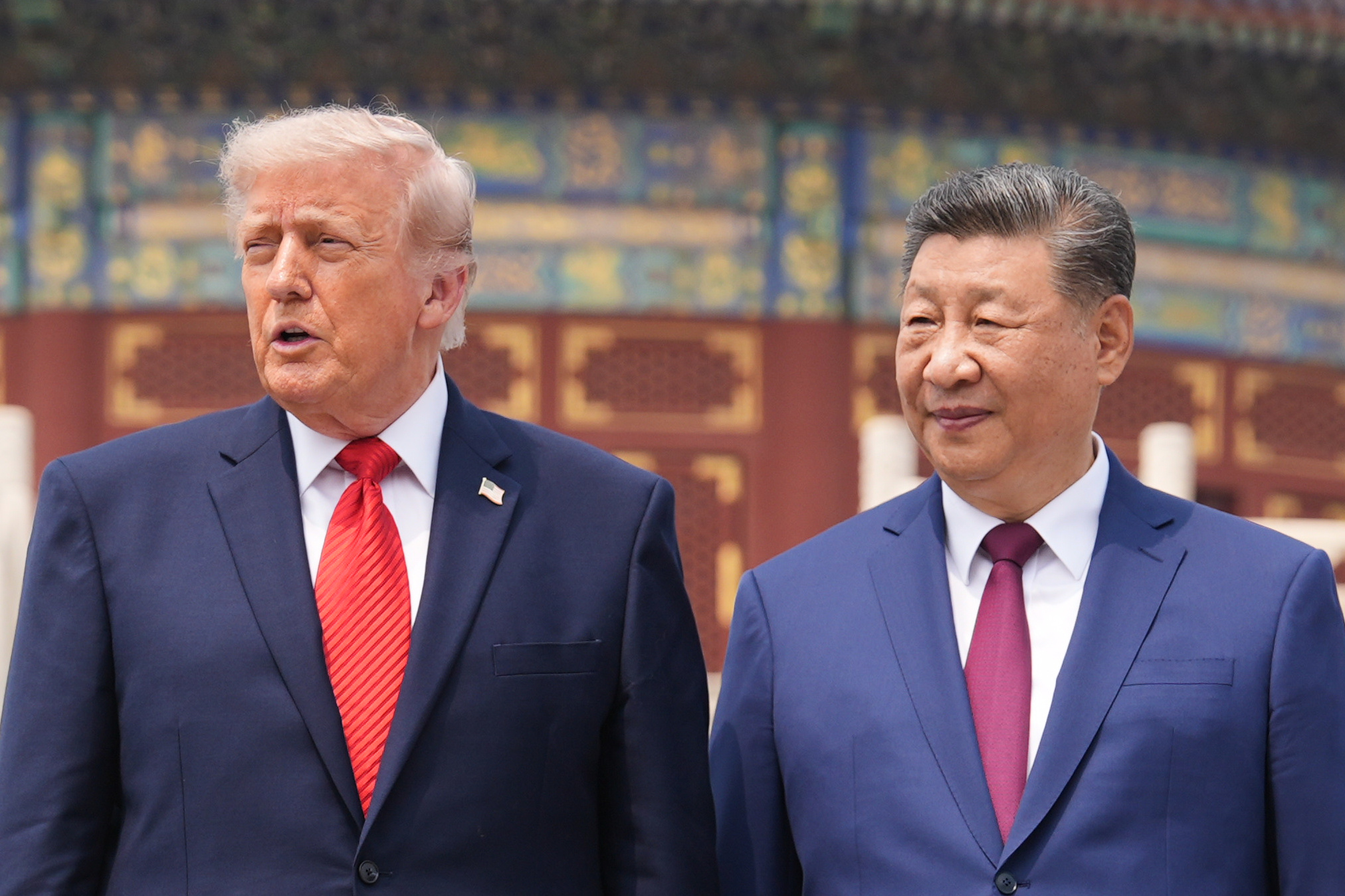 President Donald Trump, left, stands beside Chinese President Xi Jinping at the Temple of Heaven on Thursday May 14, 2026, in Beijing. (AP Photo/Mark Schiefelbein)