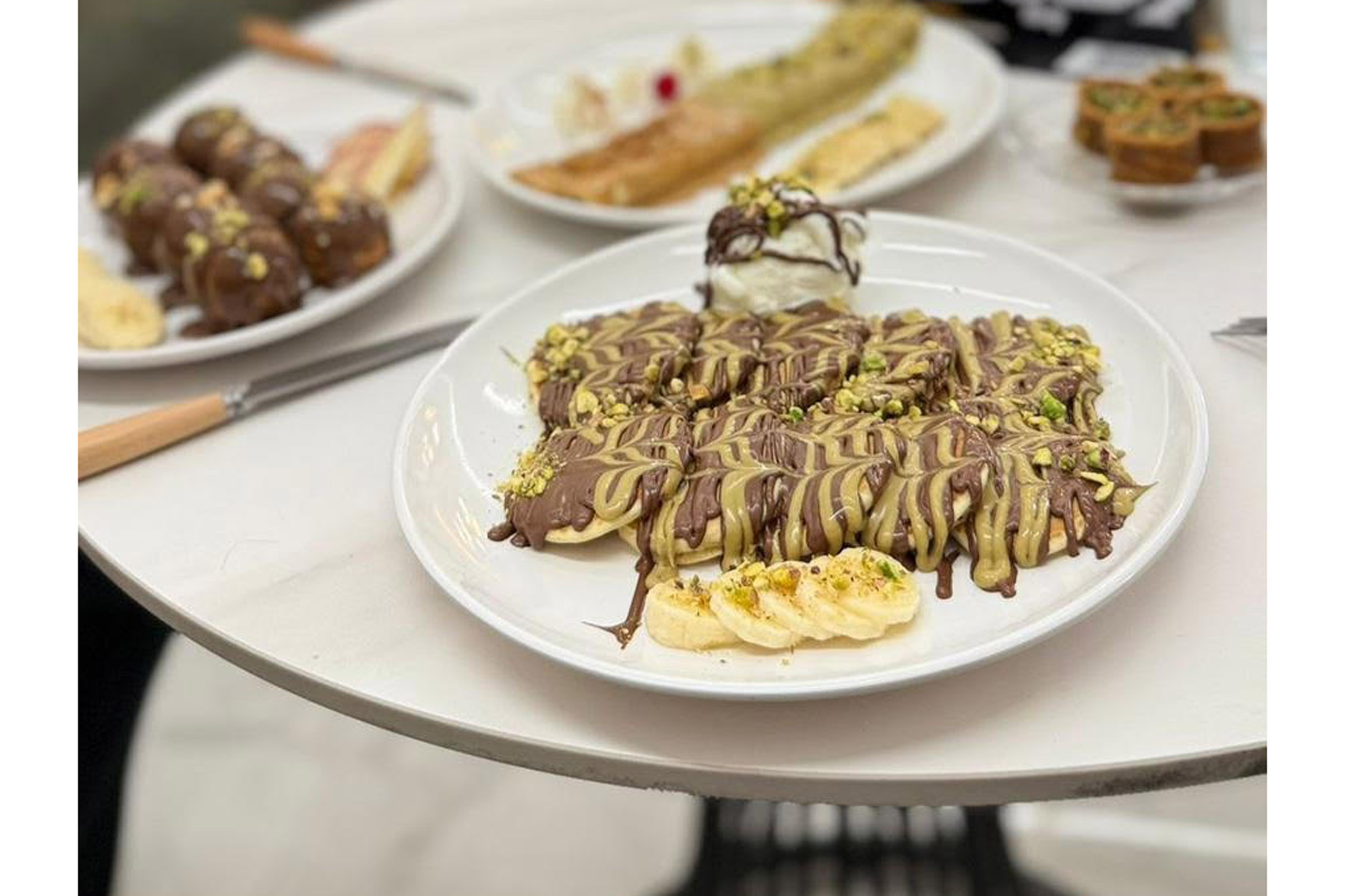 A photo of a crepe in a plate in a cafe in Gaza