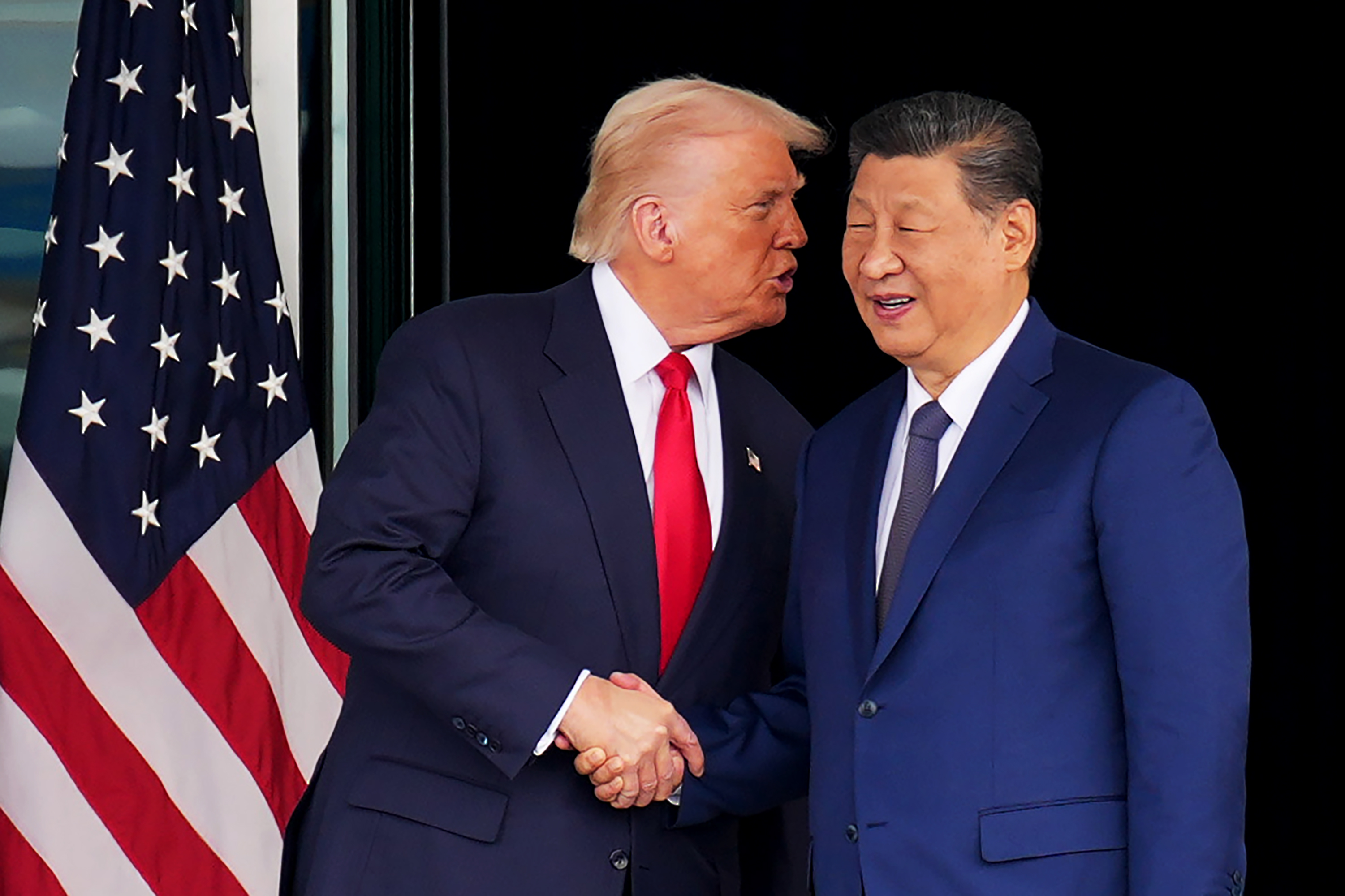 BUSAN, SOUTH KOREA - OCTOBER 30: U.S. President Donald Trump and Chinese President Xi Jinping shake hands as they depart following a bilateral meeting at Gimhae Air Base on October 30, 2025 in Busan, South Korea. Trump is meeting Xi for the first time since taking office for his second term, following months of growing tension between both countries. (Photo by Andrew Harnik/Getty Images)