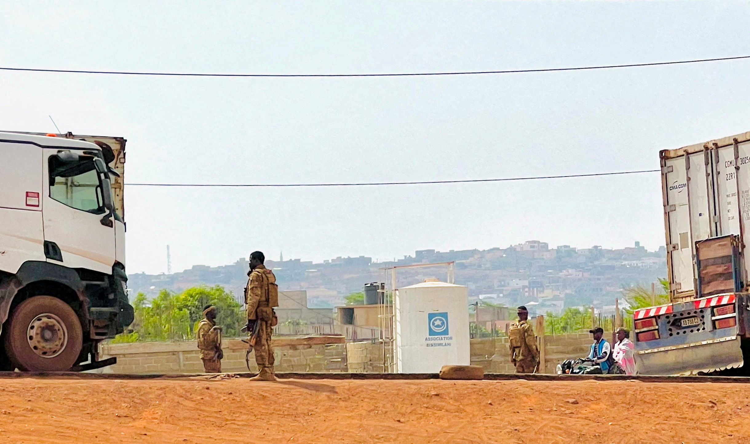 FILE PHOTO: Malian soldiers stand near a truck during a patrol following the attack on Mali's main military base Kati, outside the capital Bamako, in Kati, Mali, April 27, 2026. Picture taken with a mobile phone. REUTERS/Stringer BEST QUALITY AVAILABLE.//File Photo