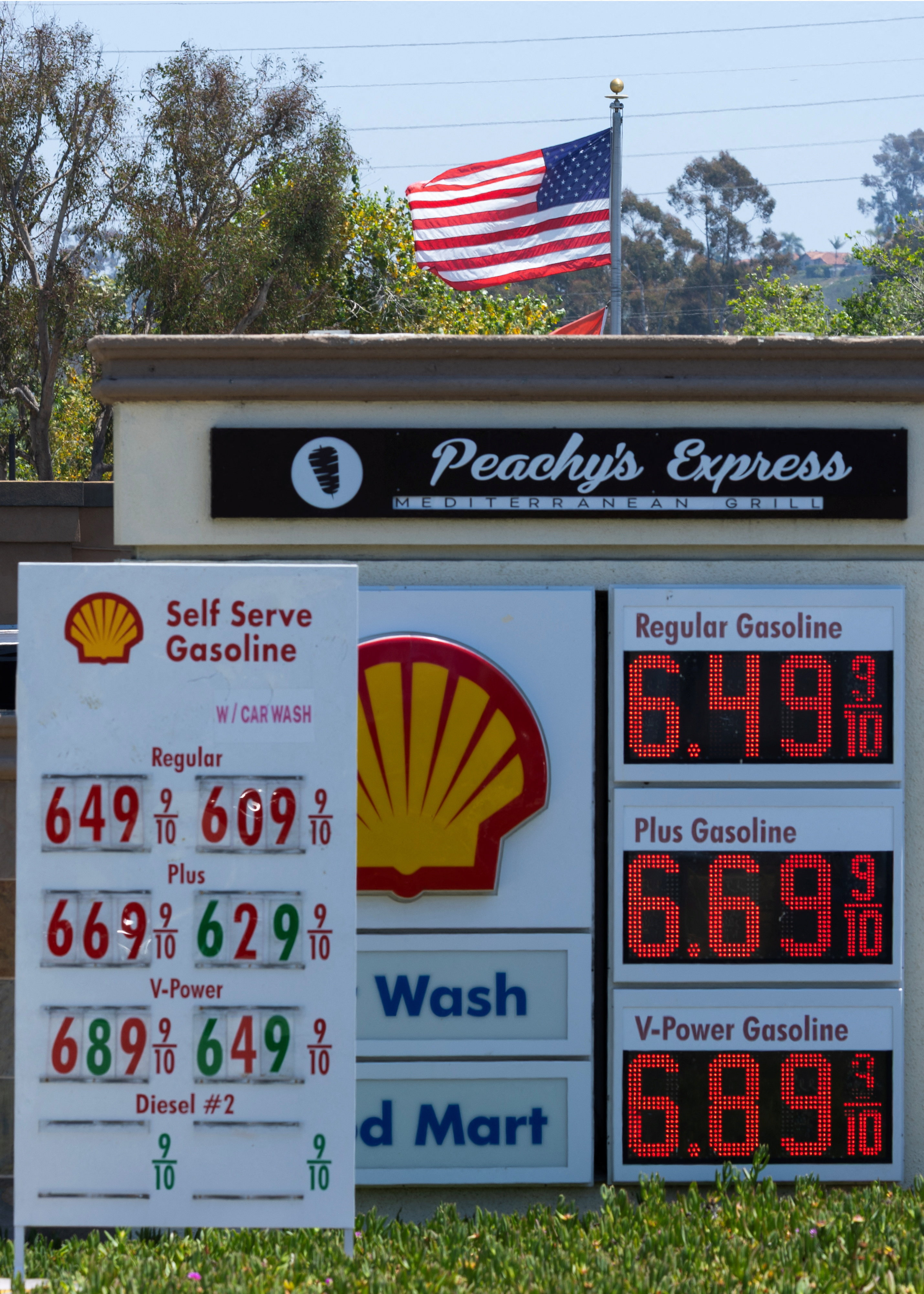 The current price of gasoline is shown at a gas station in Encinitas, California, U.S., May 11, 2026. REUTERS/Mike Blake