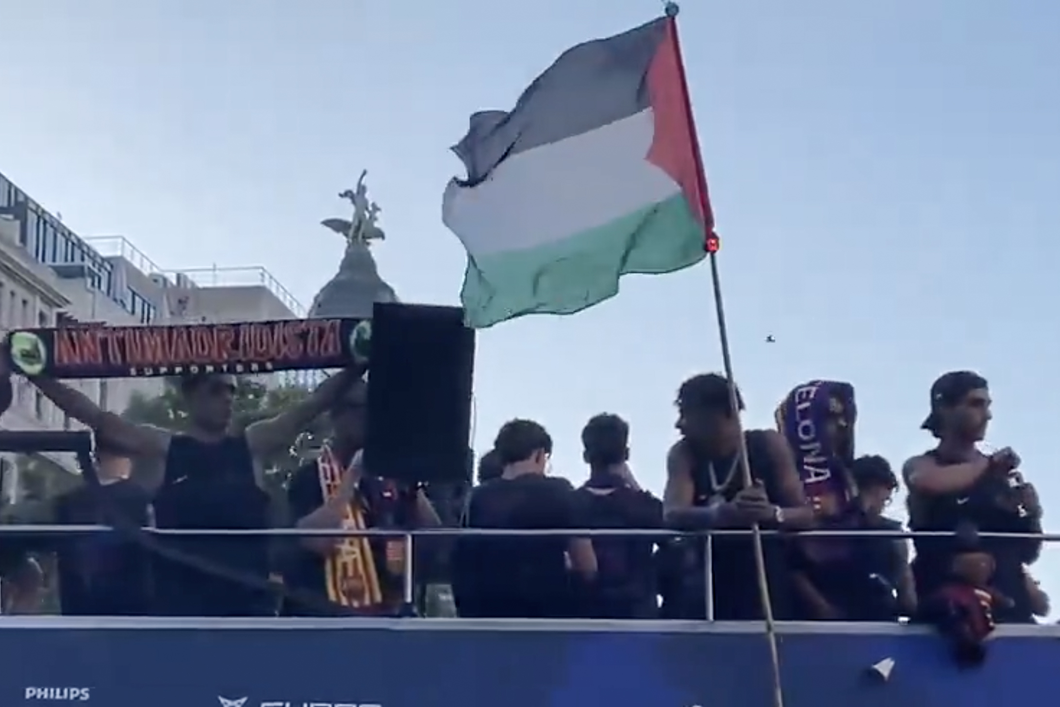 Spanish footballer Lamine Yamal waves Palestinian flag during La Liga title win celebrations in Barcelona on May 11, 2026.