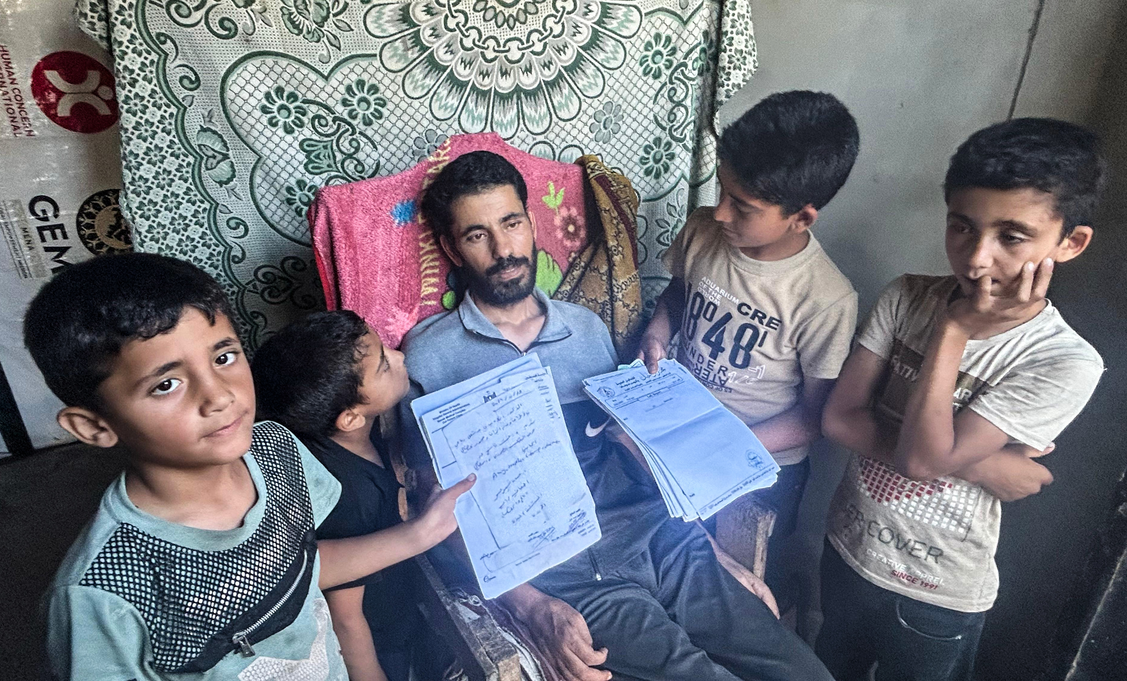 Ismail al-Aqqad and his children in Gaza