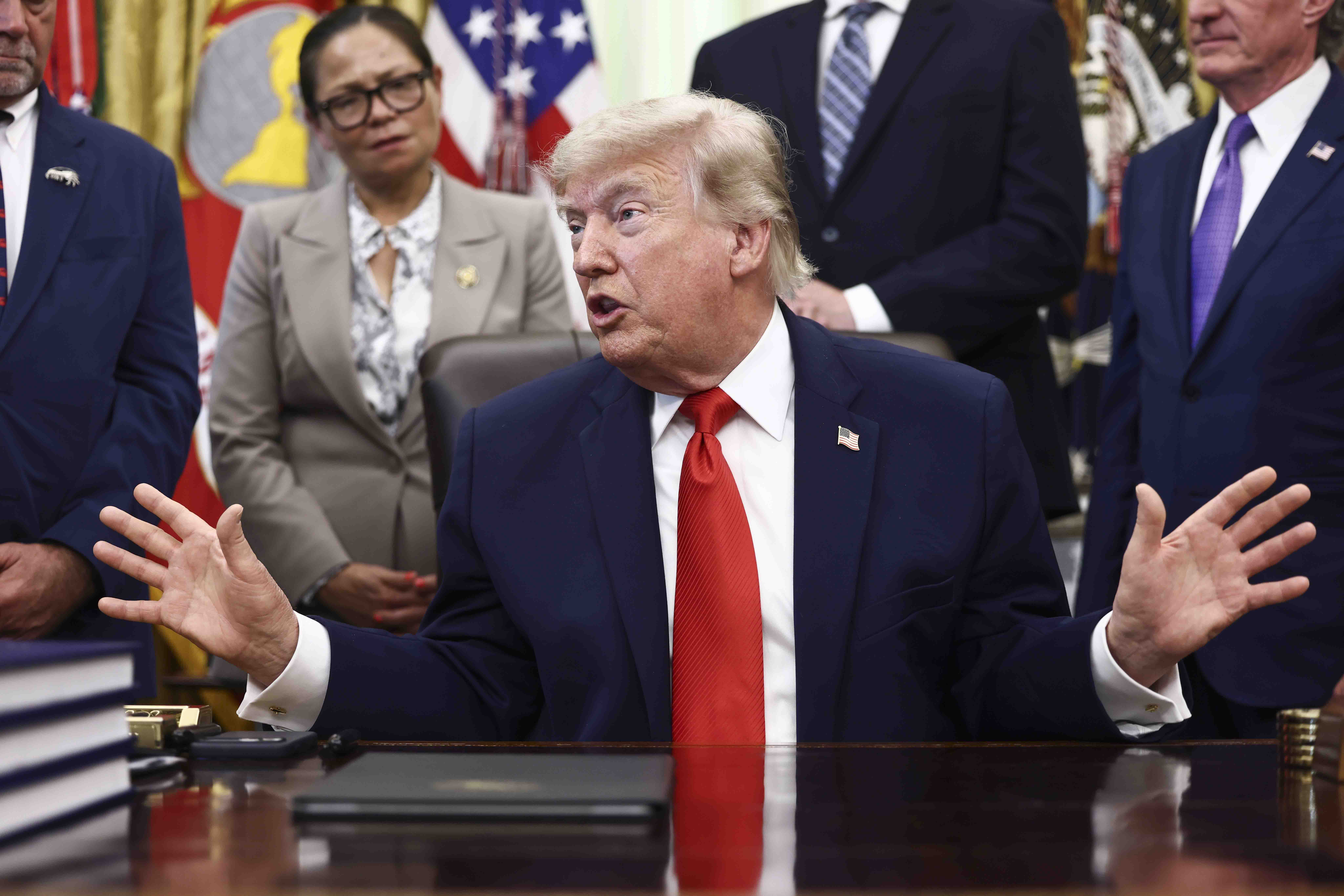 epa13031442 US President Donald Trump responds to a question from the news media after signing a fisheries proclamation in the Oval Office of the White House in Washington, DC, USA, 11 June 2026. Trump signed a proclamation opening parts of the Pacific to commercial fishing access for US-flagged vessels. EPA/JIM LO SCALZO / POOL