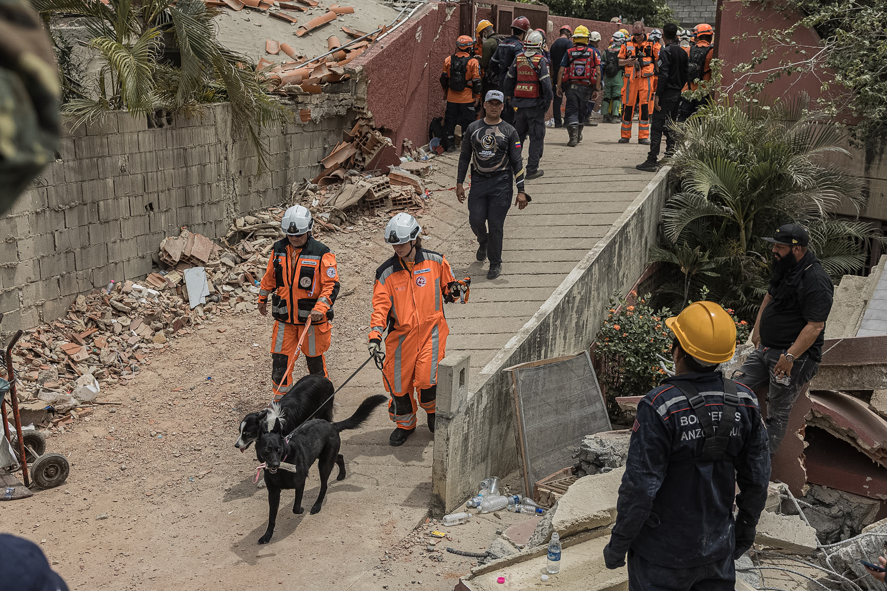 epa13070938 Rescuers work on rescue operations in an area affected by earthquakes in La Guaira, Venezuela, 28 June 2026. Venezuelan National Assembly President Jorge Rodriguez said at least 1,430 people were killed after two powerful earthquakes struck the country on 24 June. Authorities have restricted access to some disaster zones and deployed the military as relief efforts continue. EPA/Henry Chirinos