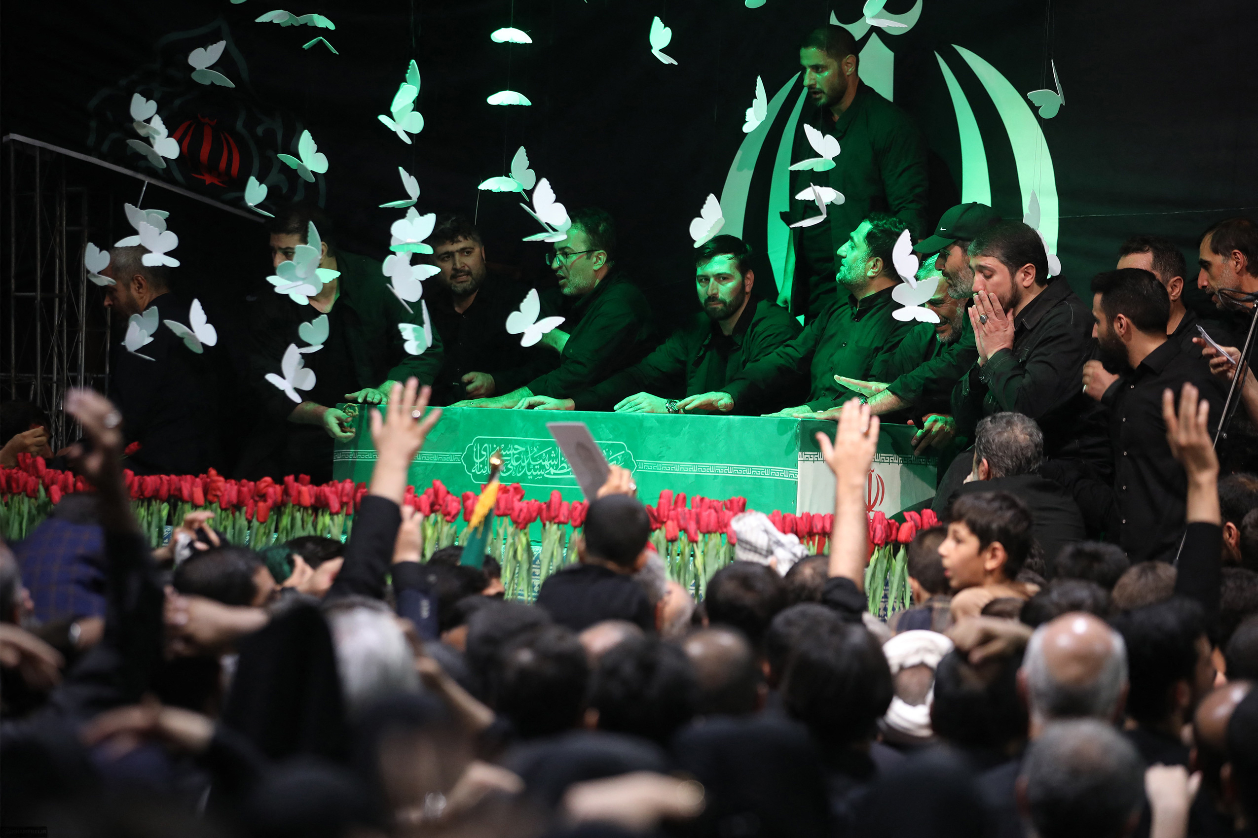This handout picture provided by the Iranian supreme leader office shows mourners gathered around the coffin of late supreme leader Ayatollah Ali Khamenei during a ceremony ahead of his funeral at the Imam Khomeini Husseiniyeh in Tehran on July 3, 2026. Khamenei's public funeral will begin on Saturday, July 4, with his body lying in state at the colossal complex in central Tehran that hosts major Friday prayers, official ceremonies and religious gatherings. (Photo by IRANIAN SUPREME LEADER'S WEBSITE / AFP) / RESTRICTED TO EDITORIAL USE - MANDATORY CREDIT "AFP PHOTO / Iranian supreme leader office" - HANDOUT - NO MARKETING NO ADVERTISING CAMPAIGNS - DISTRIBUTED AS A SERVICE TO CLIENTS