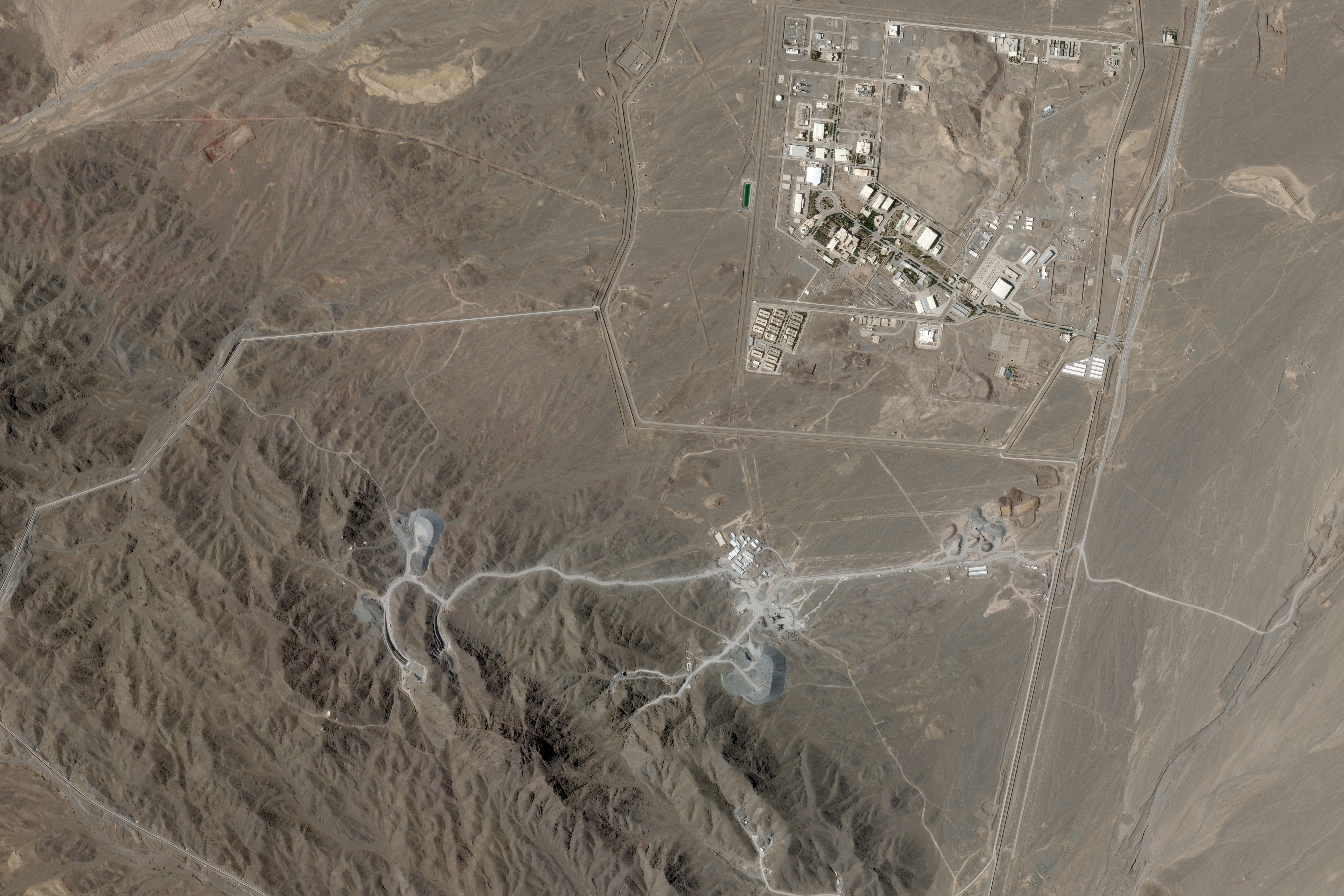 This June 15, 2026, satellite image shows Iran’s Natanz uranium enrichment facility, upper right, and an underground nuclear site that is under construction at Pickaxe Mountain directly south of it [Planet Labs PBC via AP]