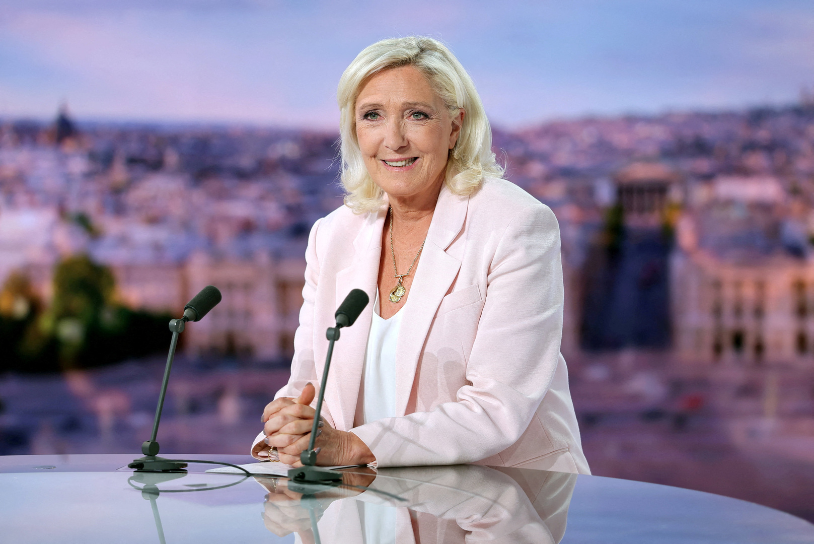 French far-right leader Marine Le Pen, member of parliament for the Rassemblement National (National Rally - RN) party, poses prior to an interview on the evening news broadcast of French TV channel TF1, following the verdict in her appeal trial over misuse of EU funds, in Boulogne-Billancourt, near Paris, France, July 7, 2026. [Christian Hartmann/Reuters]