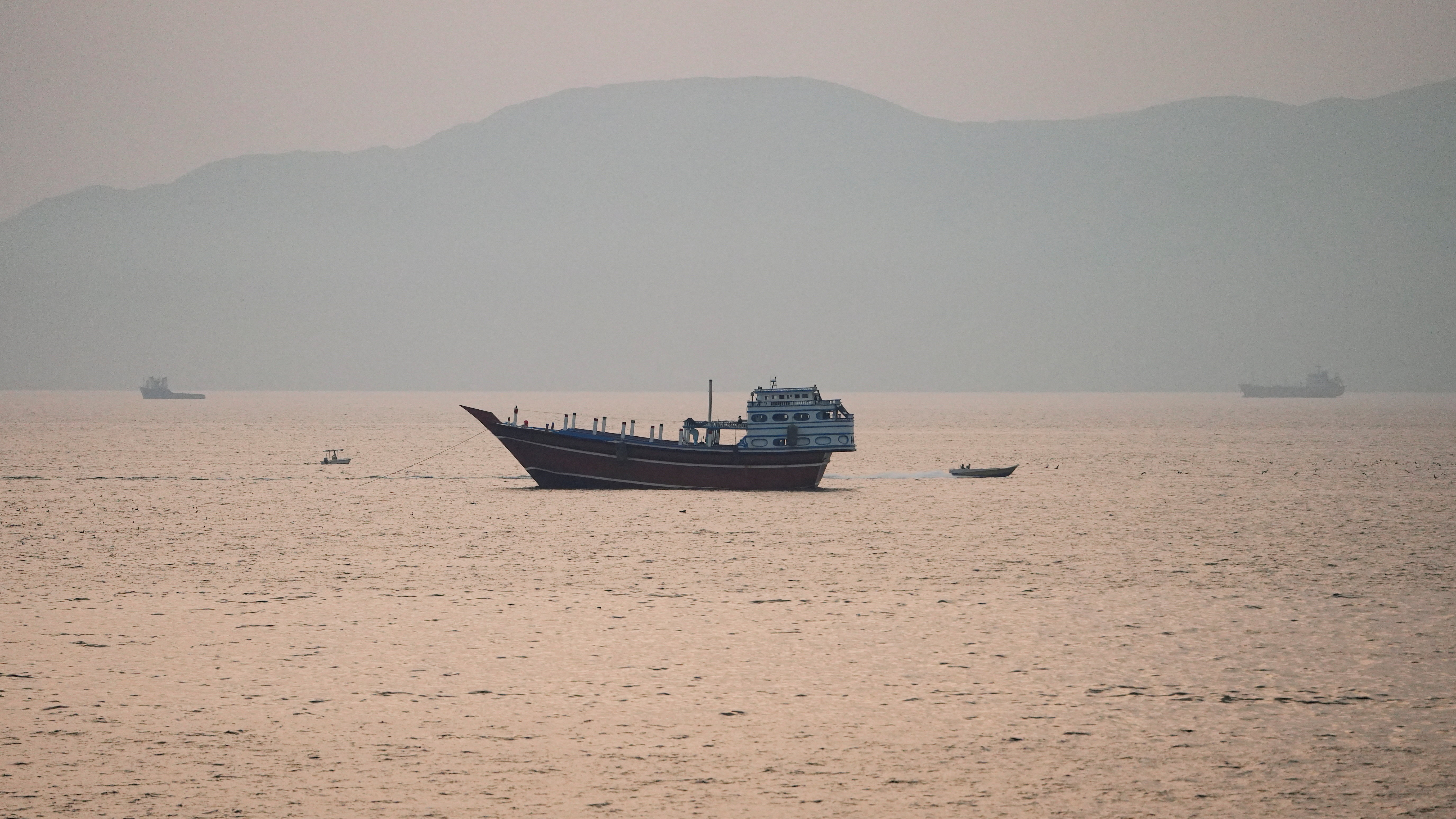 A ship seen in the distance on the water