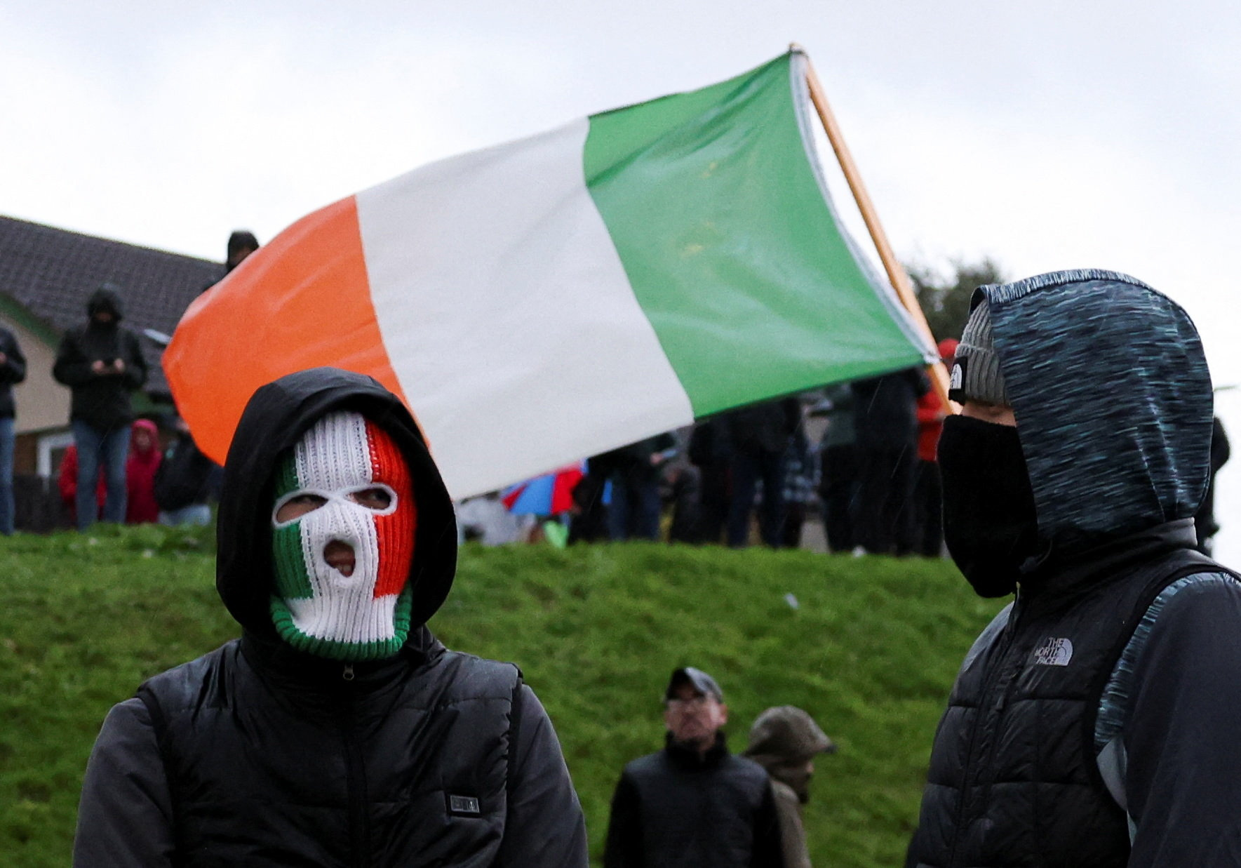 Northern Ireland protesters block Catholic area before Orange Order march