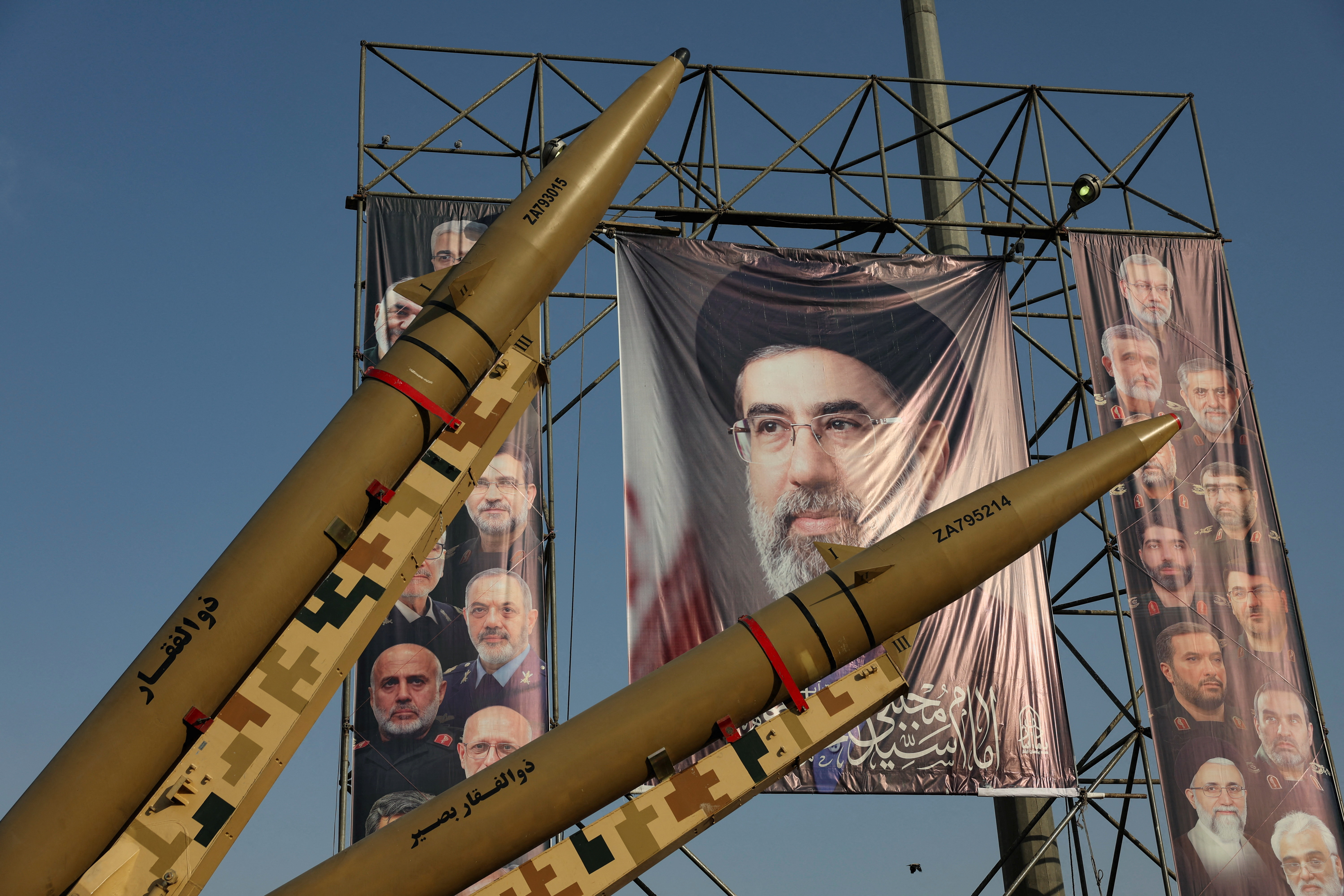 Iranian missiles are displayed next to a banner with a picture of Iran's Supreme Leader Mojtaba Khamenei, on a street in Tehran, Iran, September 27, 2026.