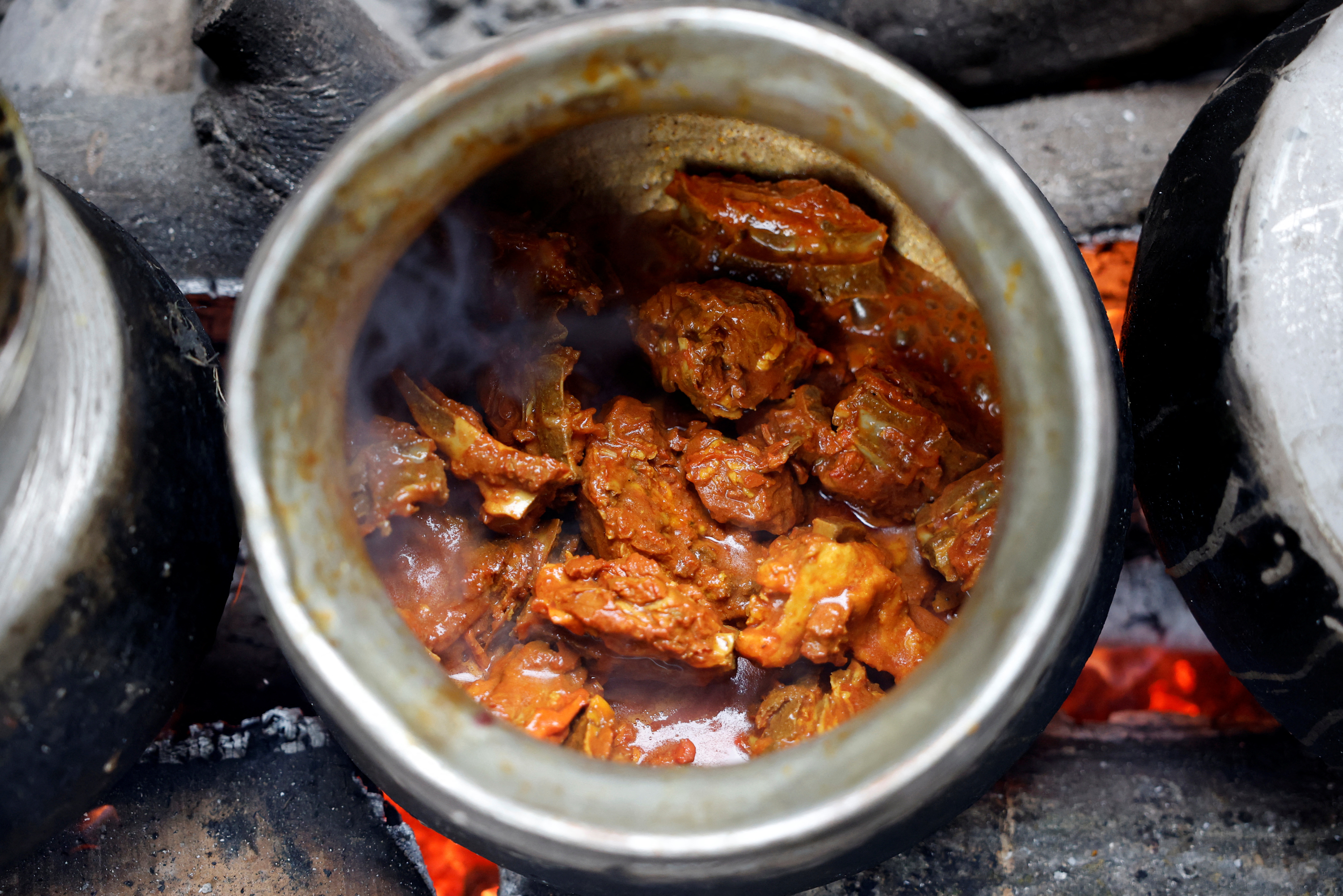 Meat is still pounded by hand and slow-cooked over wood fires, giving Wazwan its distinct texture and smoky flavour.
