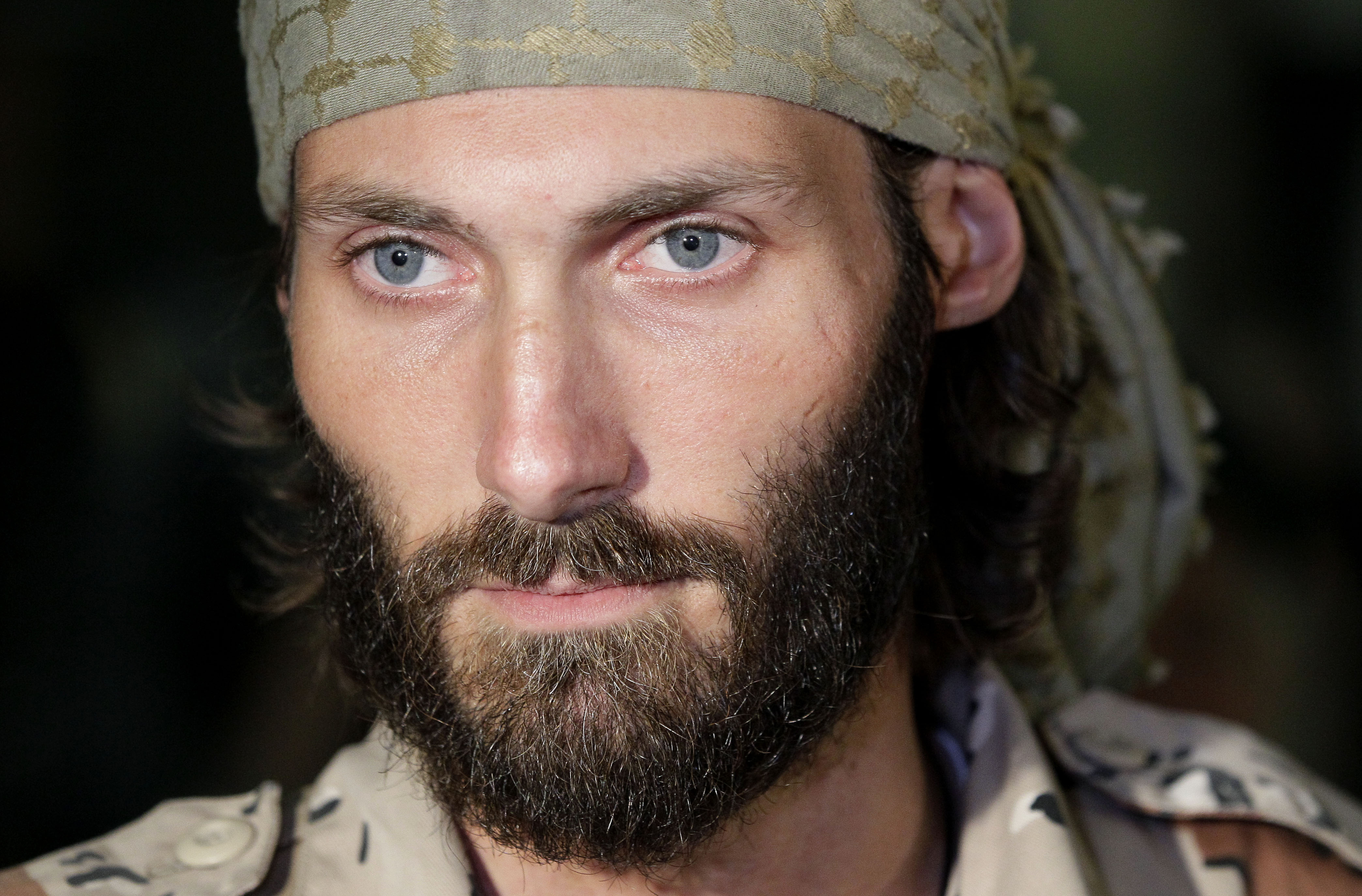Matthew VanDyke, who spent months in Libyan prisons before joining rebel forces who opposed dictator Moammar Gadhafi, speaks with reporters after his flight arrived at Baltimore-Washington International Airport, Saturday, November 5, 2011.