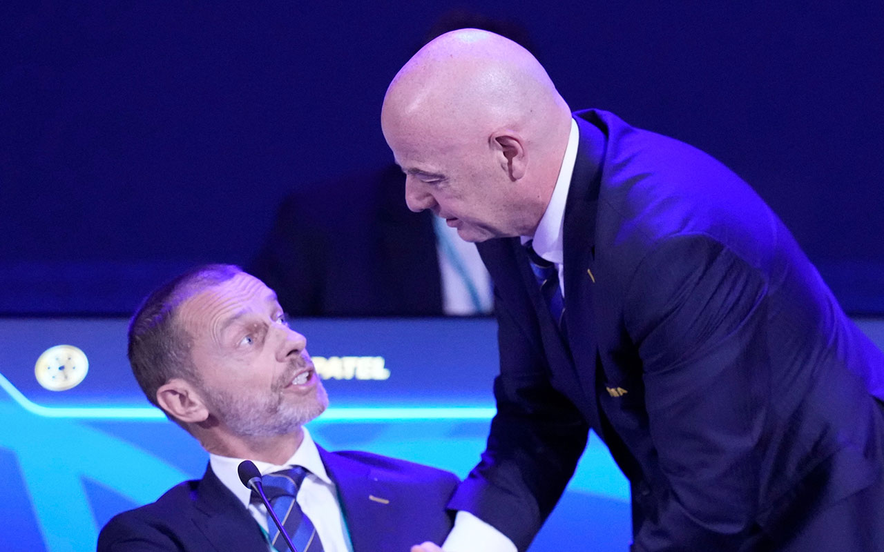 FILE - FIFA President Gianni Infantino, right, talks to UEFA President Aleksander Ceferin during the FIFA 75th Congress at the Conmebol Convention Center in Luque, Paraguay, Thursday, May 15, 2025. (AP Photo/Fernando Calistro, File)