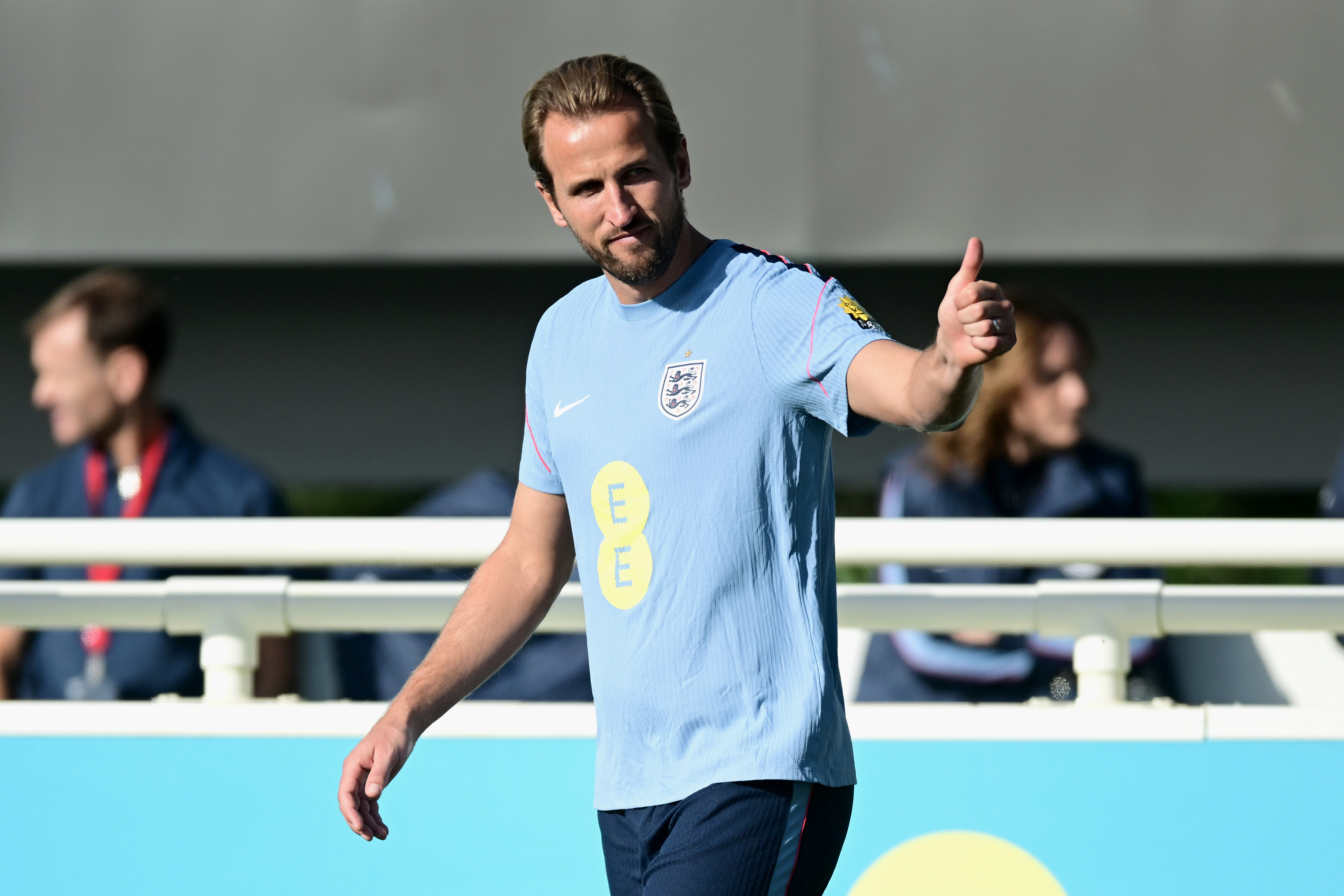 Harry Kane of England gives a thumbs-up during training.