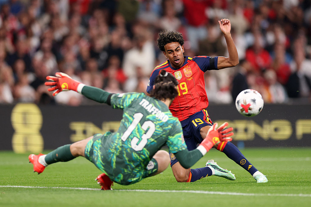 Lamine Yamal of Spain scores his team’s first goal past James Trafford of England during the UEFA Nations League 2026/27 group phase match between England and Spain