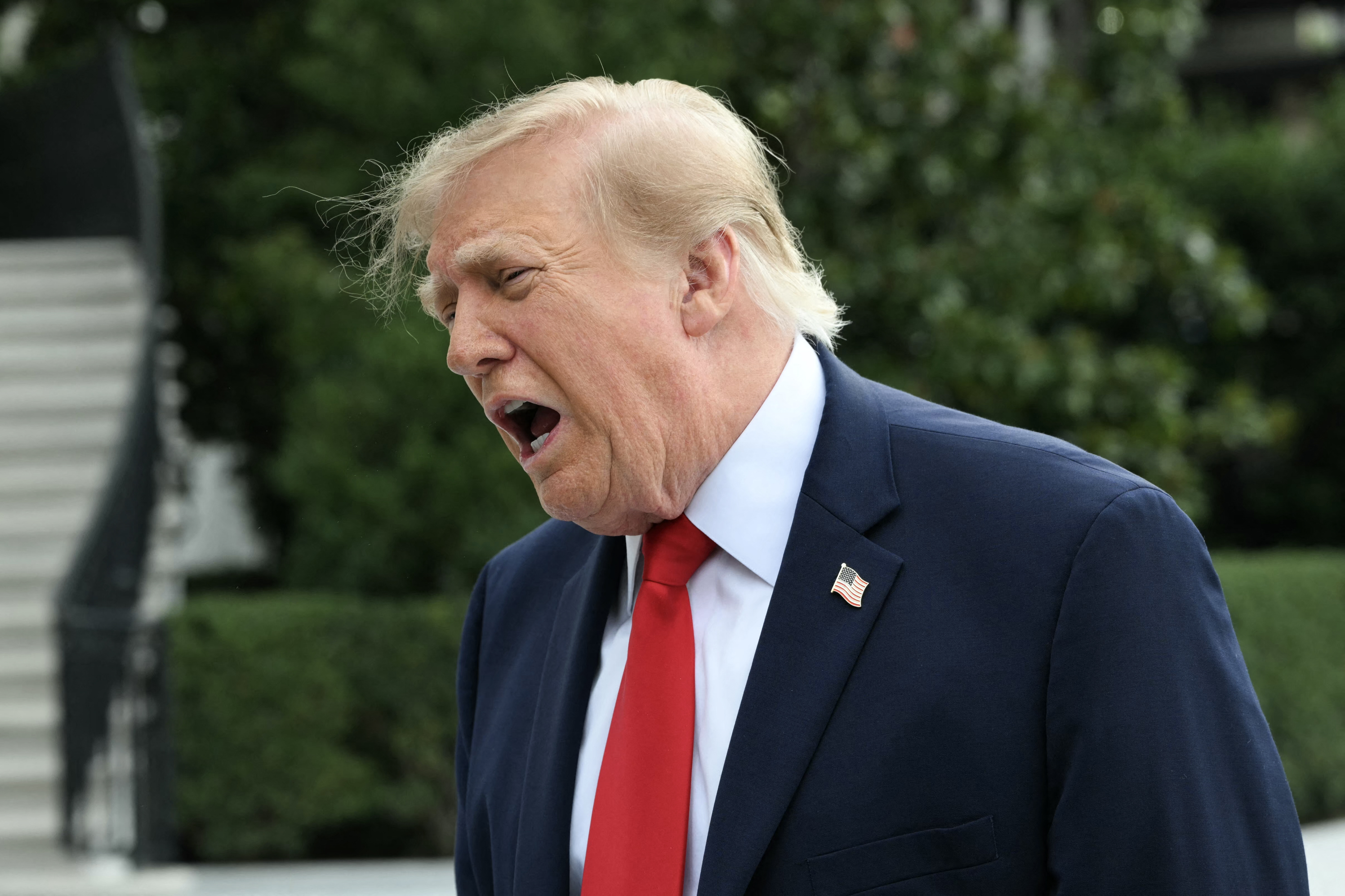 US President Donald Trump speaks to members of the press before boarding Marine One as he departs from the South Lawn of the White House in Washington, DC, on September 26, 2026.