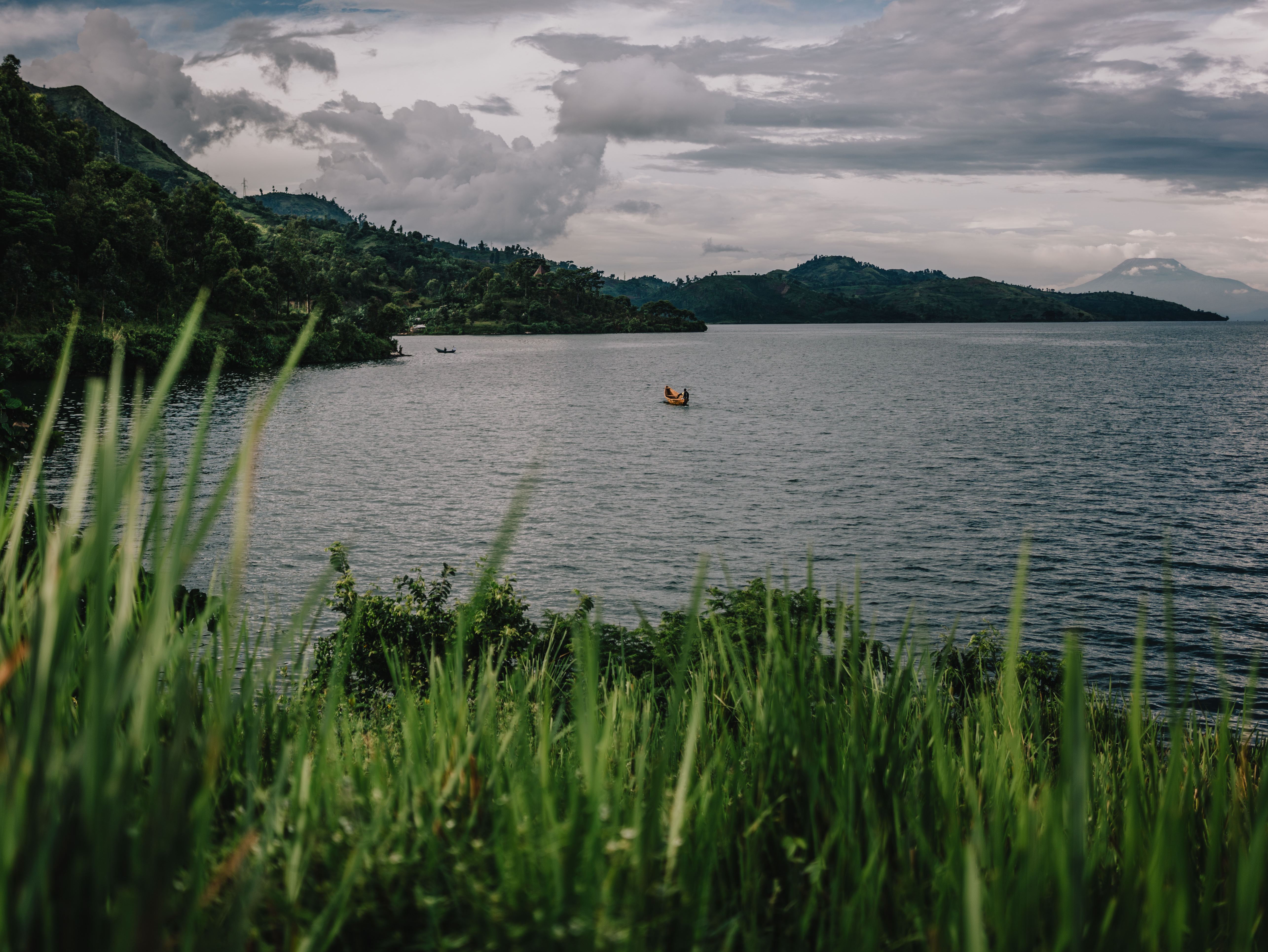 KINYEZIRE, DEMOCRATIC REPUBLIC OF CONGO - APRIL 2: A fishing boat crosses Lake Kivu on April 2, 2024 in Kinyezire, Democratic Republic of Congo. Escalating fighting between the Rwanda-backed M23 rebel group and pro-government forces in eastern Democratic Republic of the Congo has displaced hundreds of thousands of people in the eastern part of the country, swelling the population in Goma, the region's largest city.(Photo by Hugh Kinsella Cunningham/Getty Images)