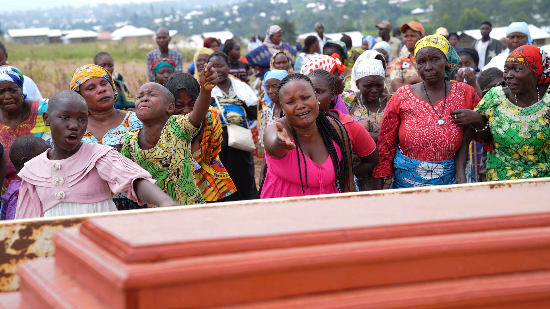 Relatives cry during the burial ceremony of Abineno Justine, a 38 year old woman who died of the Ebola virus, in Bunia, Congo, Friday, Sept. 4, 2026. [AP Photo/Dieudonne Dirole]