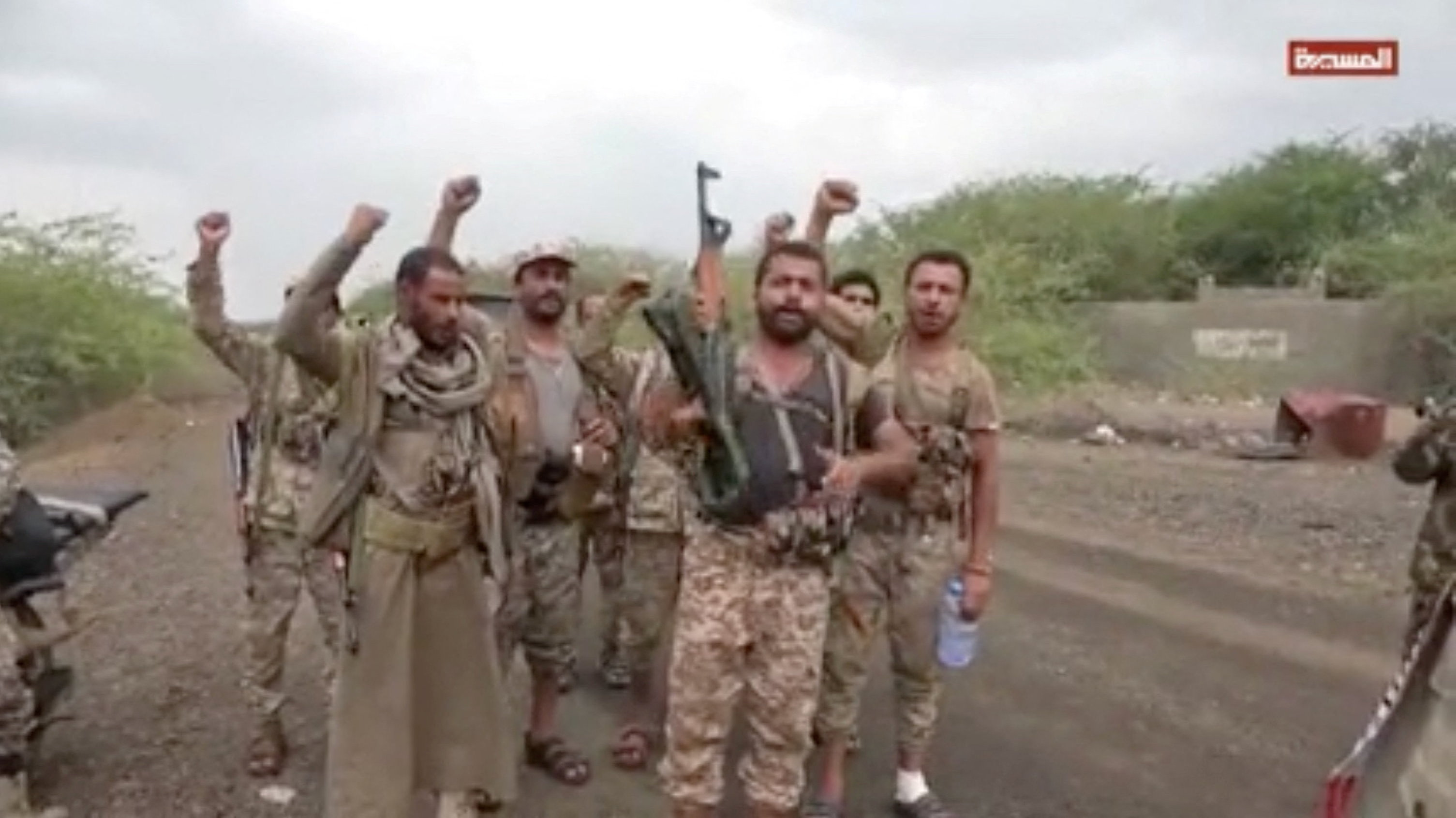 Men gesture in a screen grab from a video released September 11, 2026 and said to show Khaled bin Walid camp after Houthis captured the city of Mocha in Taiz Province, AL-MASIRAH TV/Handout via REUTERS ATTENTION EDITORS - THIS IMAGE HAS BEEN SUPPLIED BY A THIRD PARTY.  Verification: Reuters could not independently verify the location and date where the video was filmed. No older version of the footage was found online before September 11.
