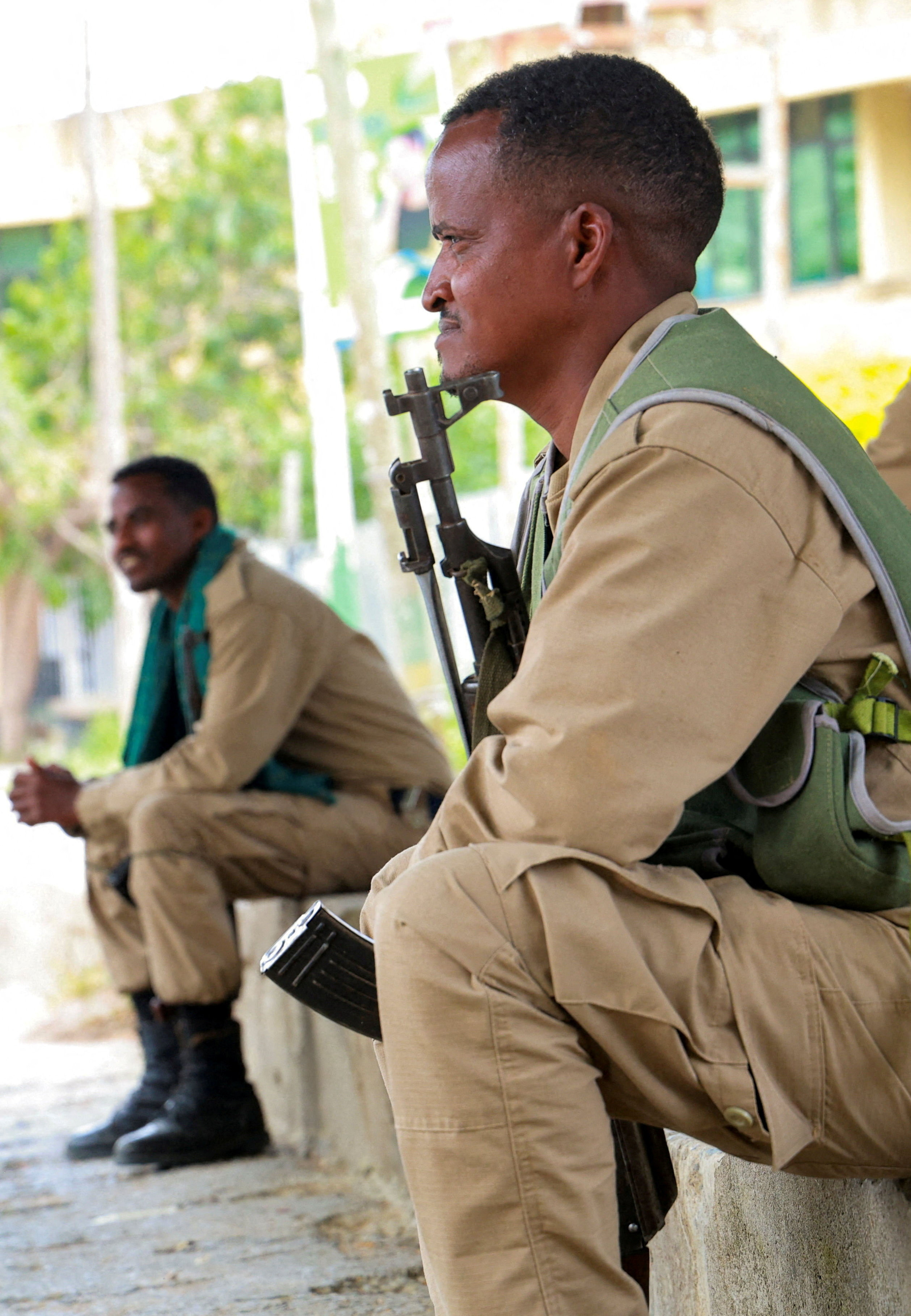 Members of the Tigrayan forces sit along a street as they patrol as tensions intensify after the forces launched a major offensive against the federal government in multiple locations, in Mekelle, Tigray Region, Ethiopia, September 24, 2026. Obtained by REUTERS