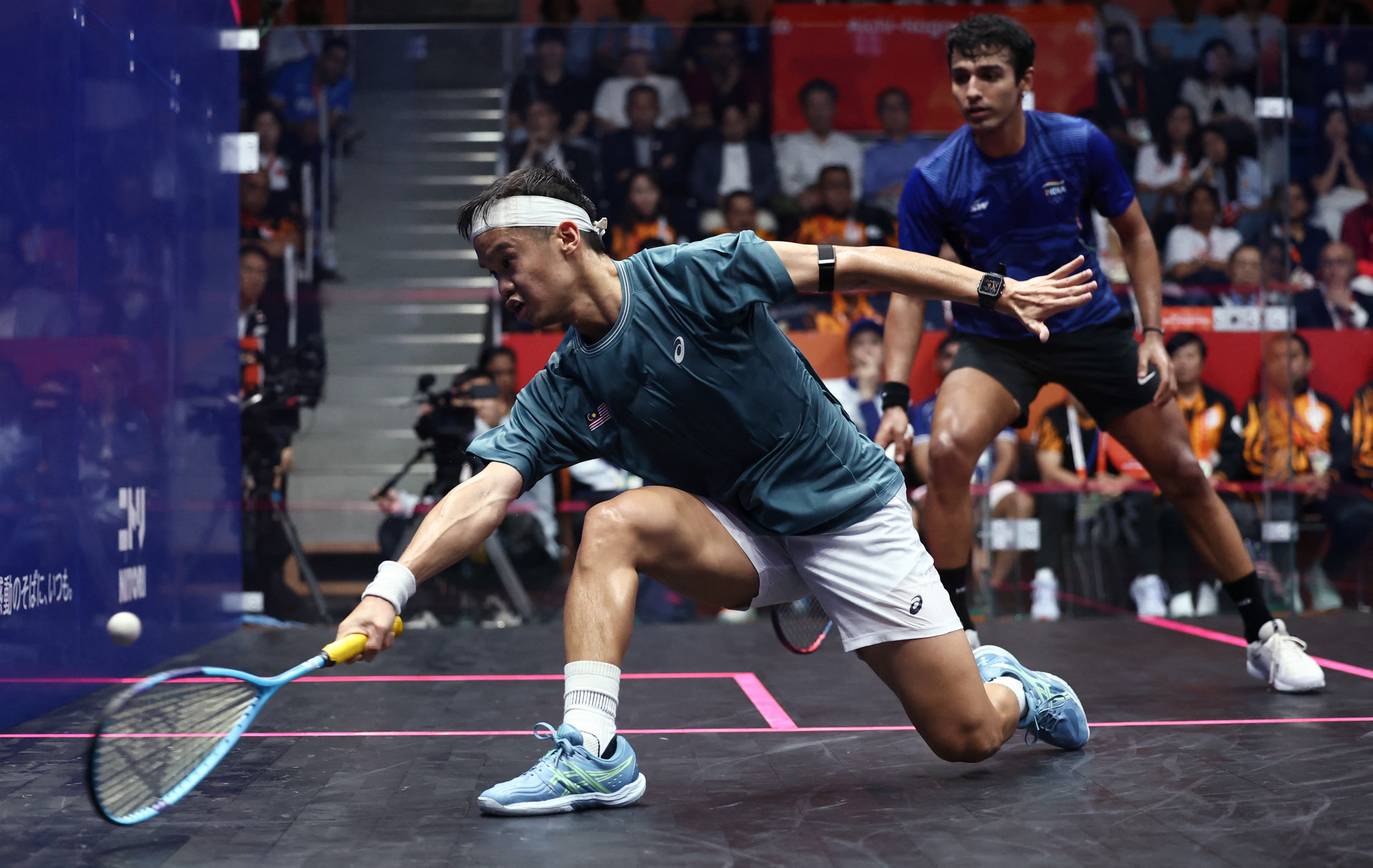 World number 18 Eain Yow Ng, left, beat India’s Abhay Singh