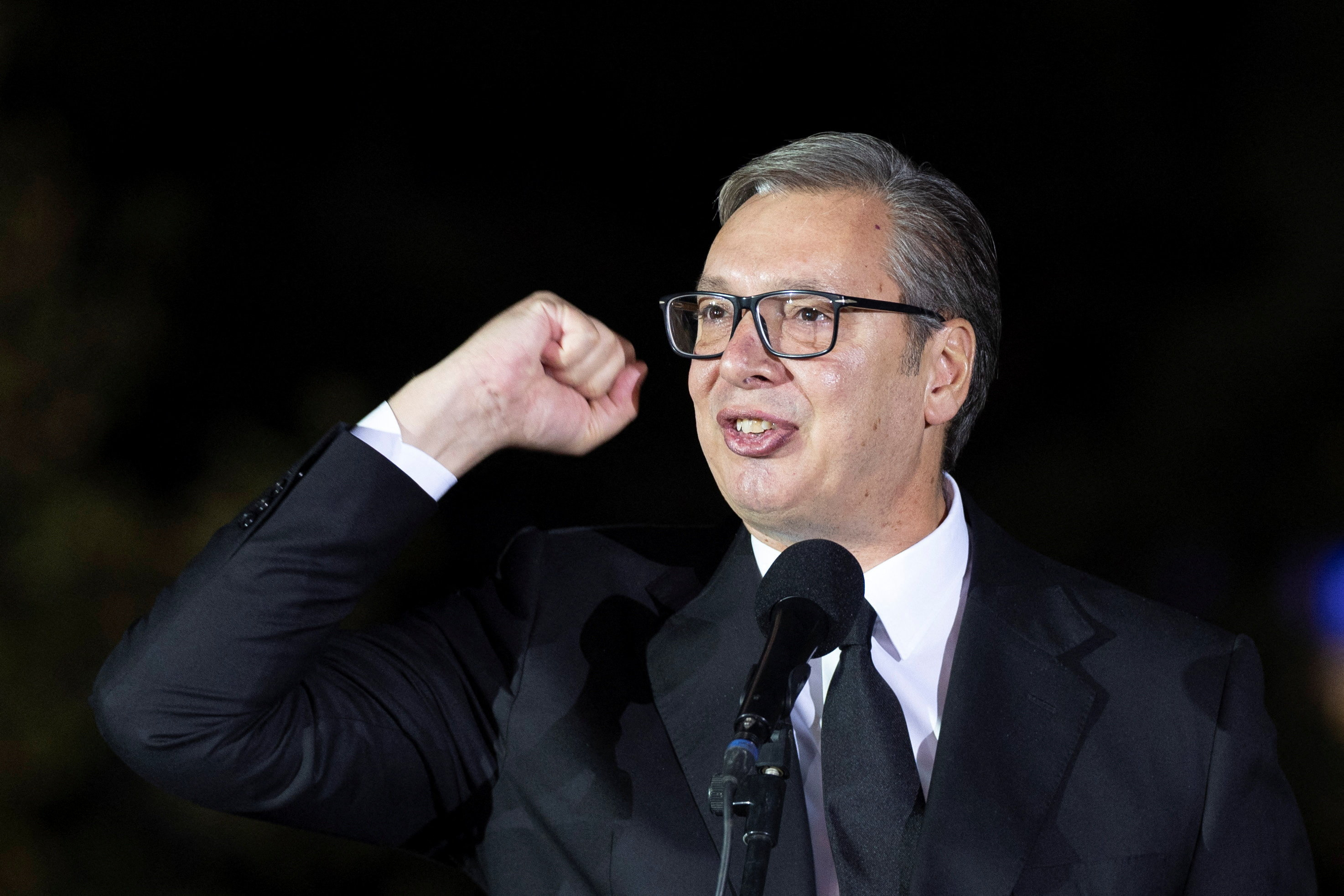 Serbian President Aleksandar Vucic gestures to citizens outside the Presidency of Serbia moments before formally submitting his resignation, ending his second and final five-year term in office, in Belgrade, Serbia, September 27, 2026. REUTERS/Djordje Kojadinovic