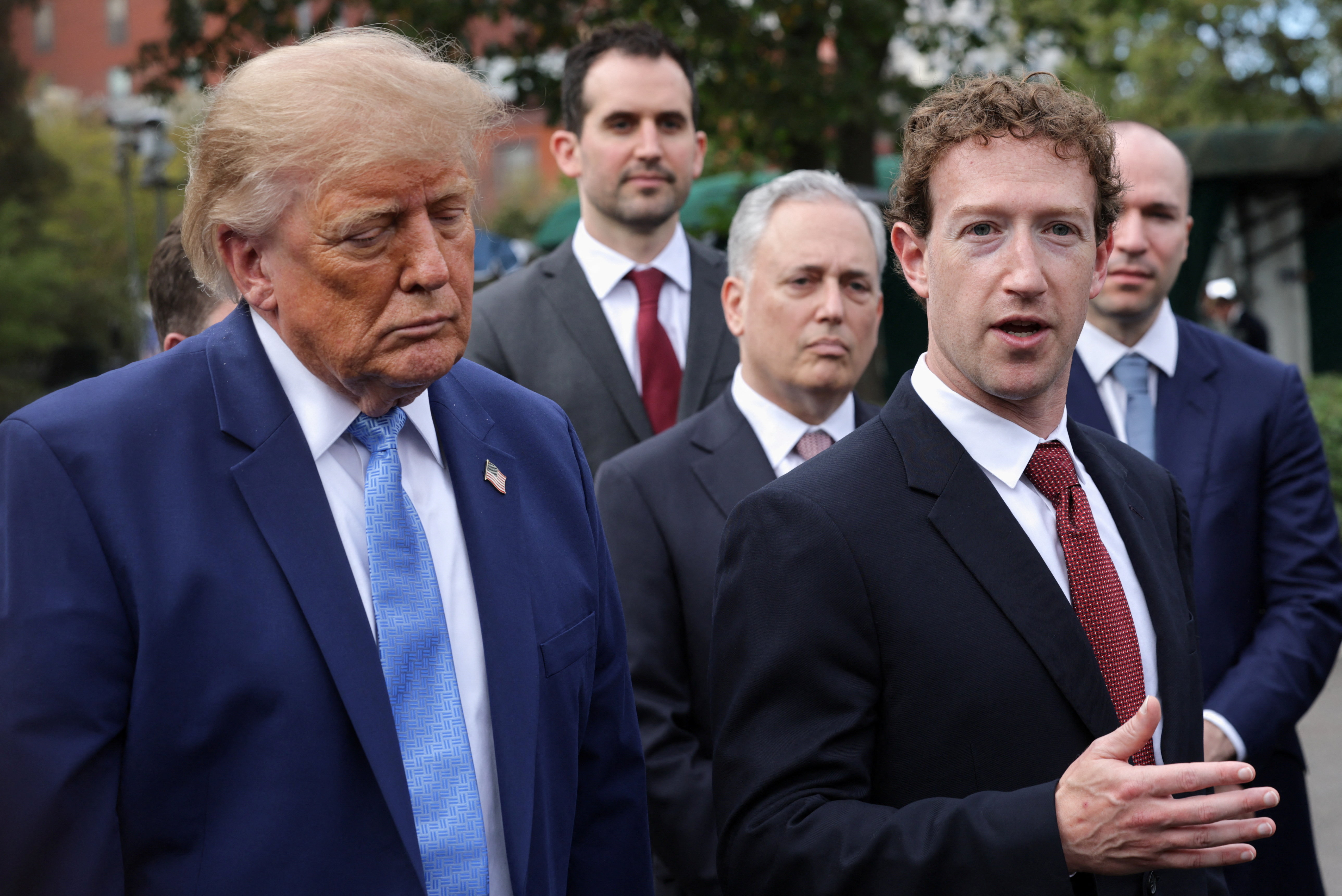 Meta CEO Mark Zuckerberg speaks as US President Donald Trump stands next to him at the White House driveway following a luncheon in the East Room, in Washington, D.C., US, September 29, 2026. REUTERS/Jonathan Ernst