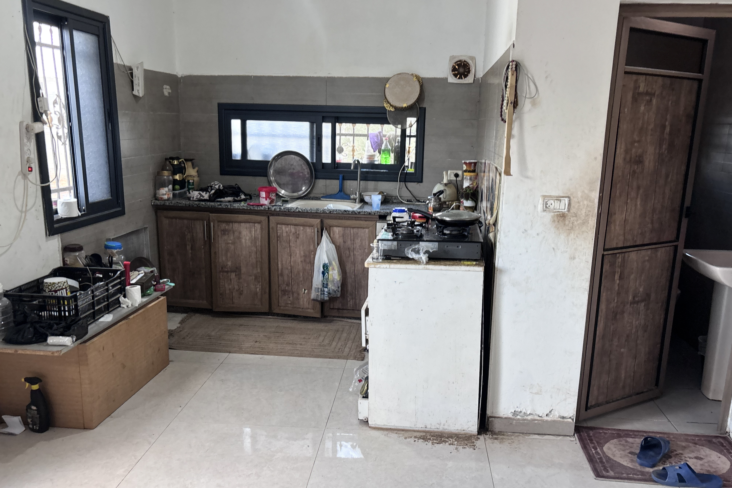The kitchen and bathroom the Zbeidats have are in the same room they sleep in [Al Jazeera]