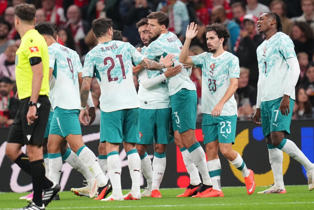 Portugal players celebrate after scoring the 1-2 goal during the UEFA Nations League match Denmark against Portugal