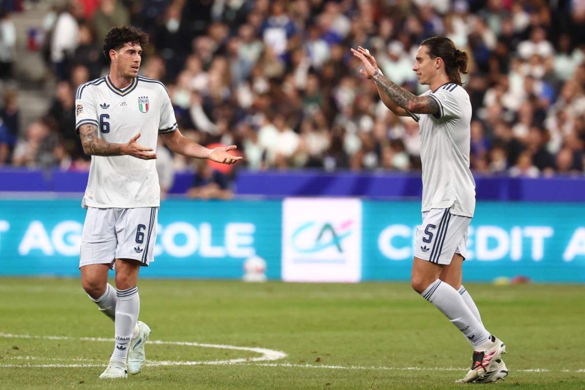 Italy's defender #06 Alessandro Bastoni (L) celebrates with Italy's defender #05 Riccardo Calafiori (R) after scoring