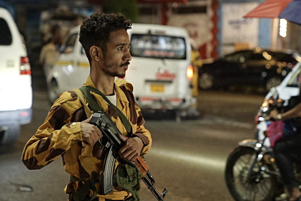 A member of the security forces of the internationally-recognised Yemeni government mans a checkpoint on a street in Taiz amid concerns over Houthi infiltration, late on September 27, 2026.