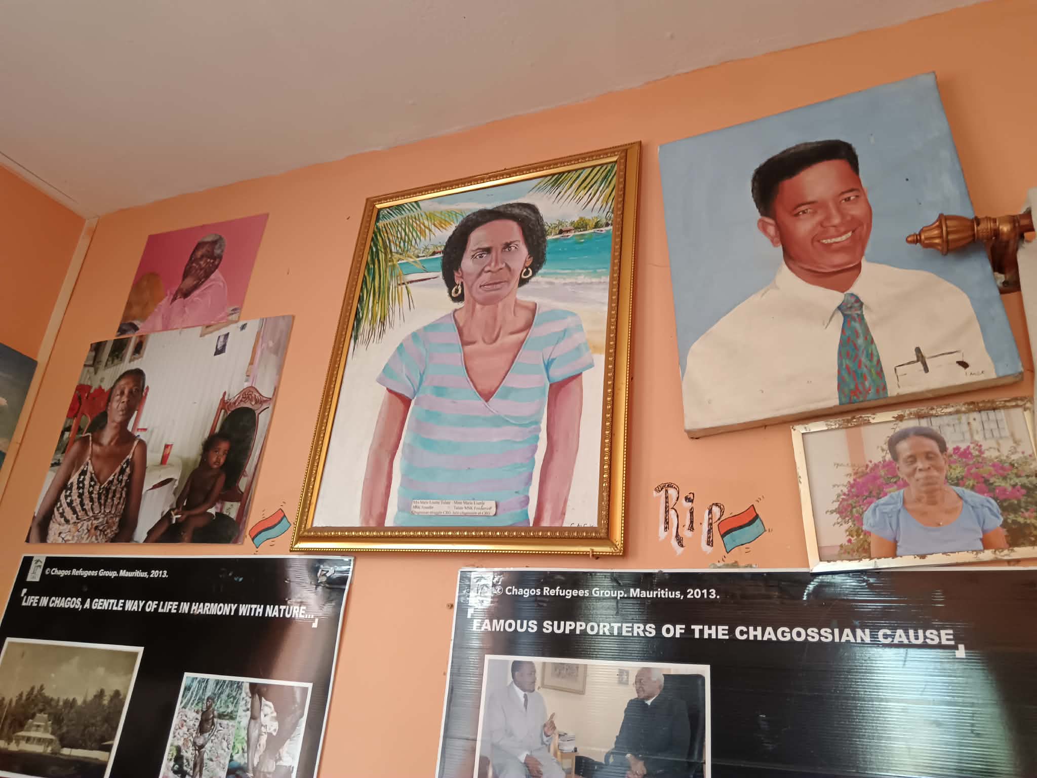 Portraits of native Chagossians who have passed away hang on the walls of the Chagos Refugees Group headquarters.
