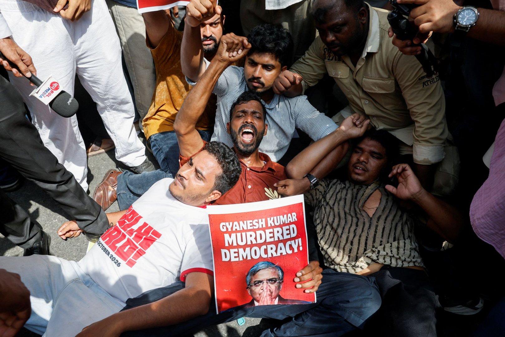 Protesters react as they are detained by the police during a protest demanding the resignation of India's Chief Election Commissioner Gyanesh Kumar, in New Delhi, India, October 2, 2026. [REUTERS/Adnan Abidi]
